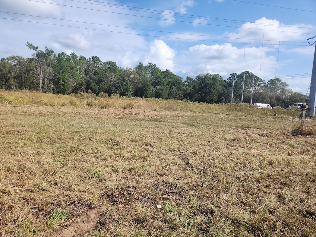 6 ACRES M.O.L. ON busy HWY 464 Maricamp Rd., Water and Sewer available, zoned B-4 with 400 ft frontage on Maricamp Rd and 400 Ft frontage on Midway Ter on the back for good access. 300 ft power easement on the front that you can not build in, but others use for parking and green area.