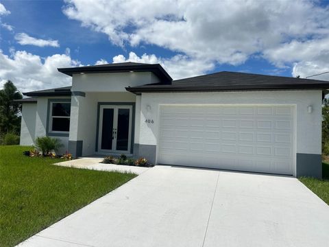 Photo of 406 Genoa Avenue S, Lehigh Acres, FL 33974 (MLS # O6353660)