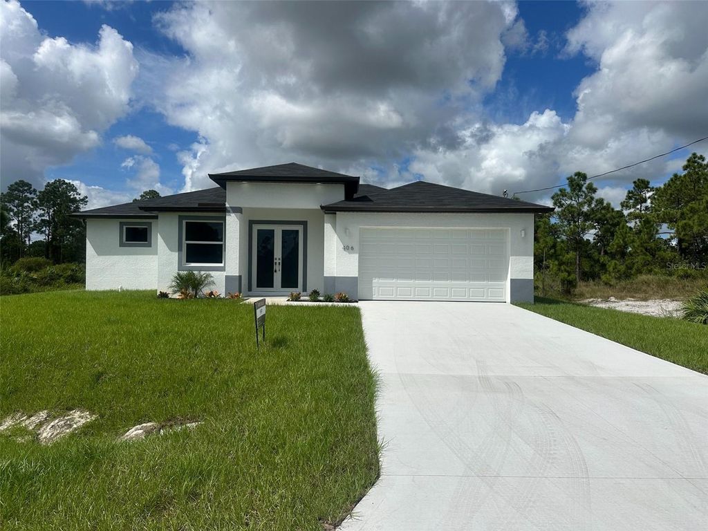 Photo of 406 Genoa Avenue S, Lehigh Acres, FL 33974 (MLS # O6353660)