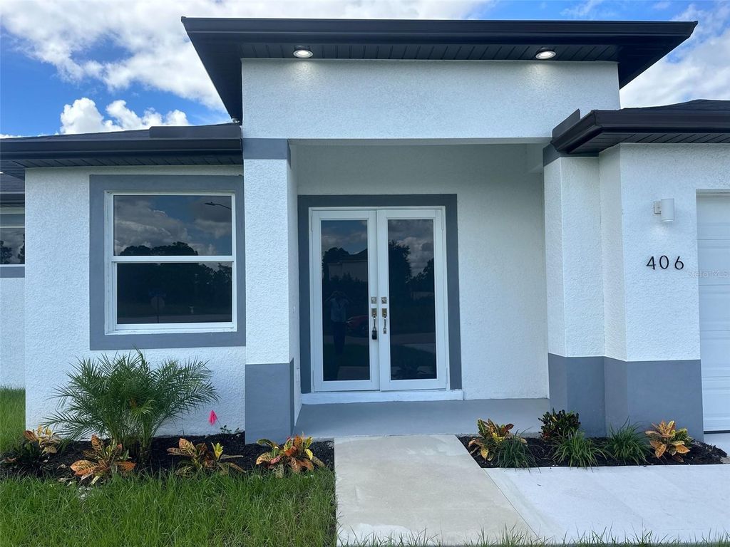 Photo of 406 Genoa Avenue S, Lehigh Acres, FL 33974 (MLS # O6353660)