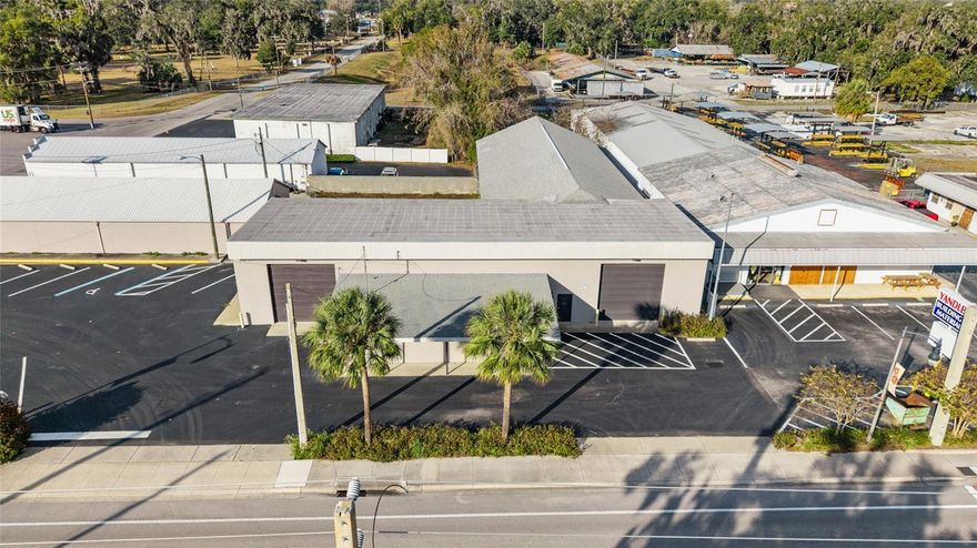 New opportunity to own an updated and renovated commercial property in the North Magnolia Business District just a couple of minutes down the street from booming Downtown Ocala! This property sits on just under an acre with B5 zoning, two buildings, and plenty of access/road frontage. The parking lot has been recently re-surfaced and striped. Both buildings have been freshly painted on the exterior. The main building showcases epoxy flooring and galvalume ceiling with spray foam insulation in the front portion, as well as fully updated offices and bathrooms, three automatic roll up doors, and is over 8,000sqft under roof. The secondary building has one office, two bathrooms, and over 3,000sqft under roof with a rear roll up door that leads to the connecting fenced in courtyard area. It also features a security roll up in front of the street storefront doors. The entire second building is climate controlled and makes for a great rental investment option. Endless opportunities and potential with this property!