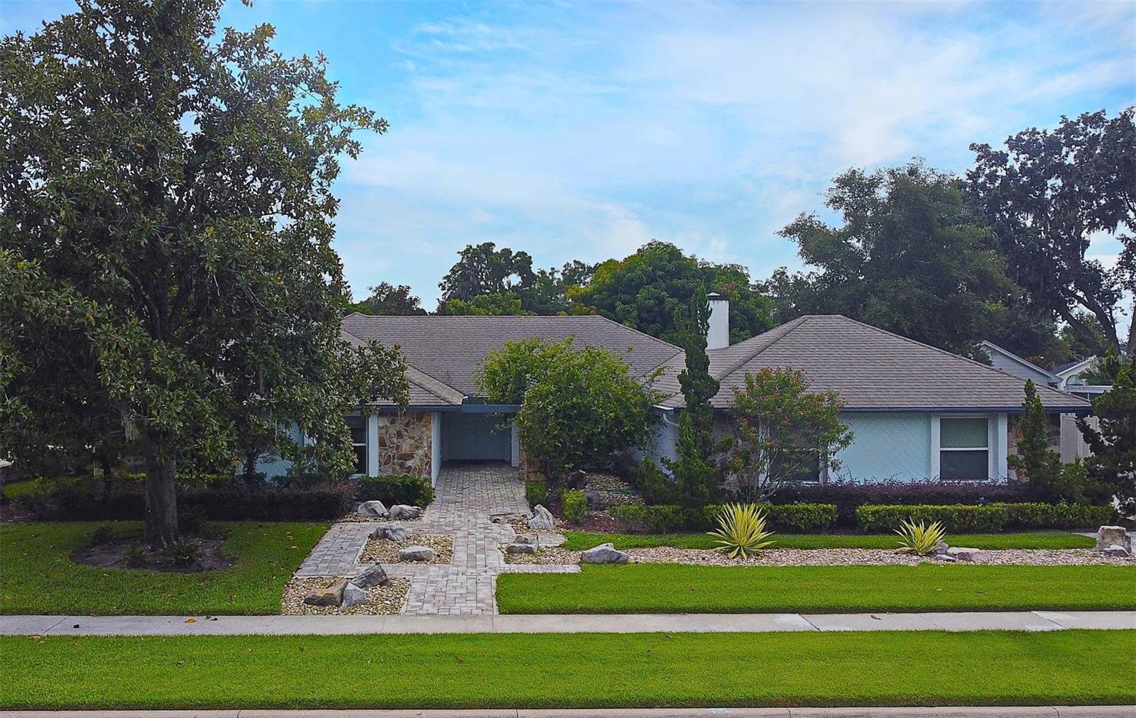 A fantastic 4-bedroom, 2.5-bath home with an office/flex space, located on a prime interior lot in the established Maitland Groves neighborhood. Major systems updated with a 40-year architectural roof (2013), Plumbing Re-pipe (2019); New windows and sliding doors (2023); Newer carpet in bedrooms; HVAC/AC (2006 with New Air Handler Blower Motor (Sept. 2025)), water heater (2008), and a whole-house generator (2008). Highlights include an open floorplan, cathedral ceilings, a cozy fireplace, and a spacious, updated island kitchen, white cabinetry with a breakfast nook. The large laundry/mudroom conveniently connects to an oversized side-entry 2-car garage, perfect for groceries and kids. A flex space overlooking the backyard offers great potential as an office, fitness area, or playroom. Both bathrooms feature double sink vanities, and the primary suite has sliding door access and views of the backyard. The property is landscaped for privacy, featuring a partially covered front entry courtyard and both open and covered patios in the backyard. Located in a top school district near Lake Sybelia Elementary, with easy access to parks, sport courts, bike paths, shopping, restaurants, a hospital, and the I-4 corridor.