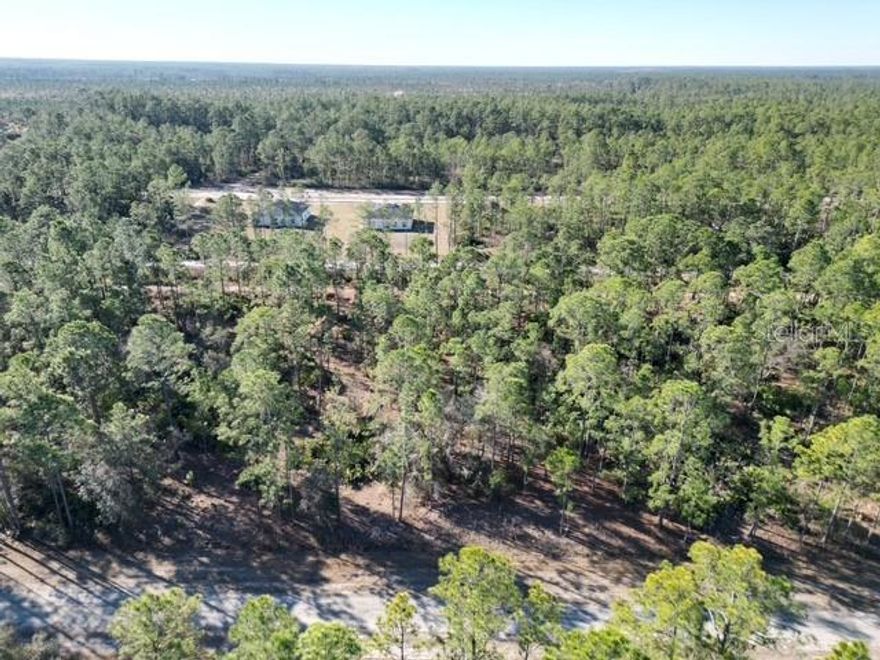 Build your Florida dream home on this spacious lot in the lake and golf community of Indian Lake Estates. With plenty of room to design your ideal home, this property offers privacy and flexibility while still enjoying access to outstanding community amenities. Residents have access to Lake Walk-In-Water, a 7,500+ acre lake known for exceptional bass fishing, along with a private marina, boat ramp, clubhouse, fitness center, tennis courts, and an 18-hole golf course.

Rare opportunity: The adjacent lot is also available for purchase. Side-by-side parcels are seldom offered at the same time — secure both before one sells and the opportunity is gone. Owning both provides expanded space, enhanced privacy, and flexibility for a larger estate-style build or future investment.
