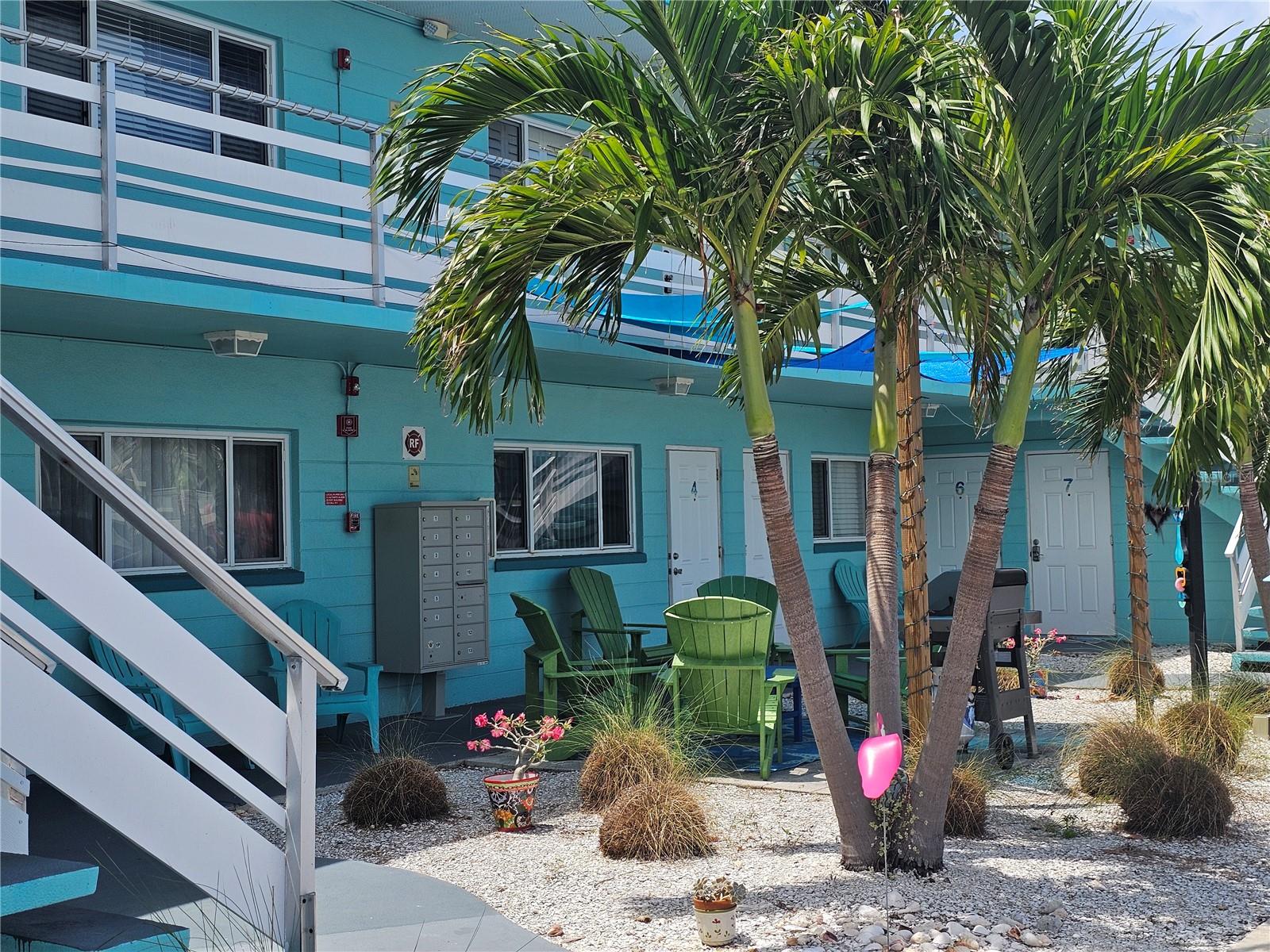 **Charming Beach Condo!** This adorable condo had no flooding or wind damage during the 2024 hurricanes and is just two blocks from famous Upham Beach access without crossing Gulf Blvd. Enjoy a small patio with lights and grill right outside your door, and be close to restaurants, shopping, and a beach trolley. Located on the first floor of a small Beach community, the condo is perfect for full-time living or as an investment property, with a 30-day rental minimum. It features wood flooring in the living room, tile in the kitchen and bathroom, and a walk-in shower with double heads. The private bedroom has a built-in desk, shelving, and two closets, with additional storage throughout. Other perks include an assigned parking space, an extra storage locker, and on-site laundry. Pets under 20 pounds are welcome. Enjoy peace of mind with a full-time manager, full reserves, and all required state inspections!