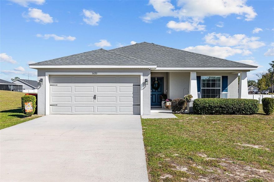 Best of both worlds, conveniently located near 200 and with No HOA! Lovely craftsman-style home built in 2020, offers 4 bedrooms and 2 bathrooms with 1,725+/- square feet of living space, situated on a .34 acre lot in the quiet SW Ocala neighborhood of Sandy Pines, minutes to 200, schools and shopping. This home features open concept living with volume ceilings, neutral color palette, white cabinetry, large kitchen island with white Corian countertops, suite of stainless appliances, front porch and screened lanai. The generously sized primary suite features sliding doors to the lanai, the en-suite bathroom features a soaking tub, tiled walk-in shower, double vessel vanity, water closet and walk-in closet. This concrete block home is built for the modern lifestyle and features low e-windows, energy efficient R-30 insulation, energy efficient LED recessed lighting, programmable thermostat and easy to care for vinyl plank flooring. Additionally the home features window treatments, ceiling fans and irrigation.