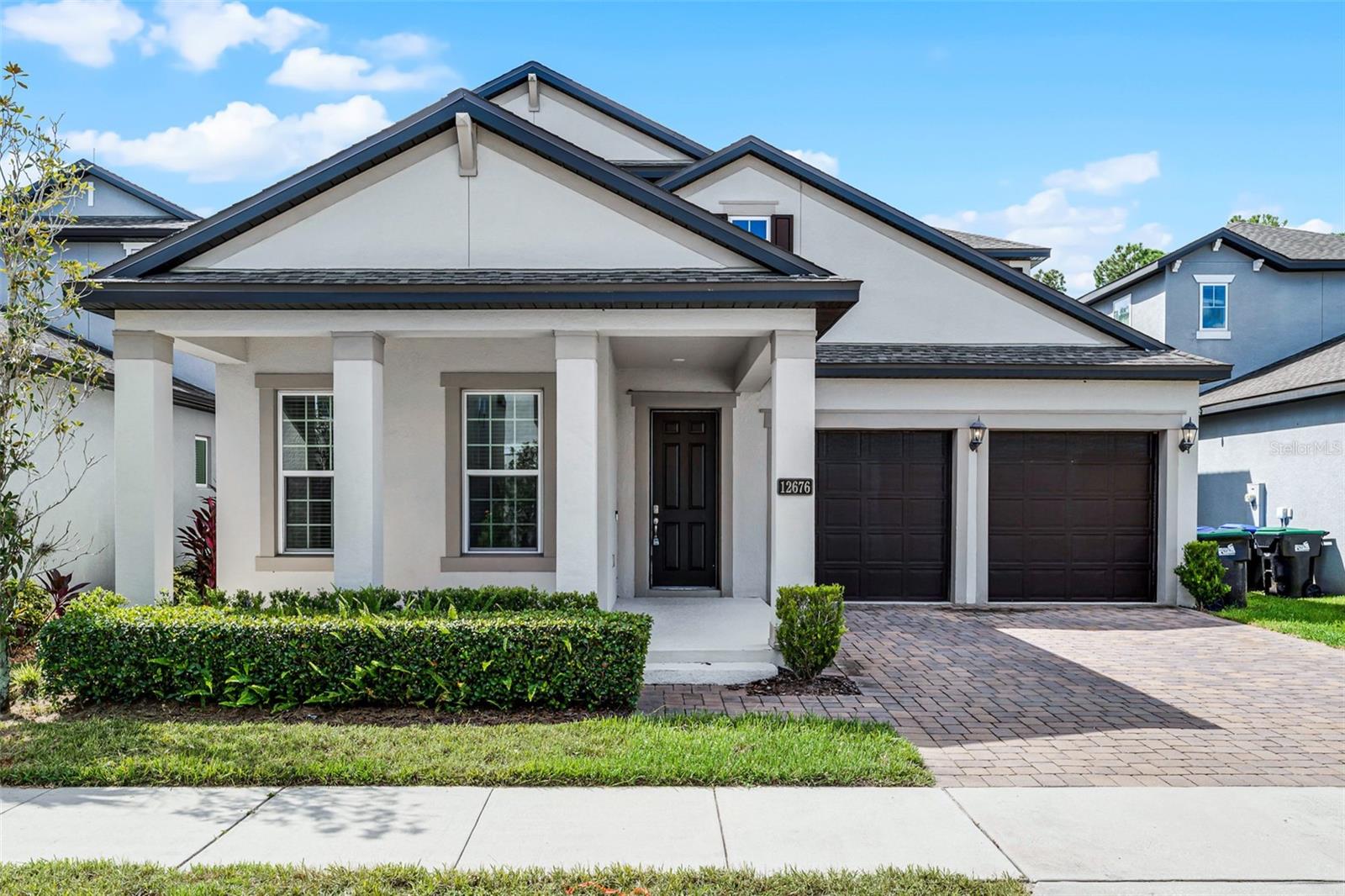 Welcome to this rare 6-bedroom, 4-bathroom single-family home offering over 3,600 sq. ft. of living space in the highly desirable community of Westside Village in Windermere. Nestled in a top-rated school district and just a 10-minute drive to Walt Disney World, this home combines comfort, convenience, and exceptional location. The thoughtfully designed floor plan is perfect for large families or anyone who values extra space. The primary suite is located on the first floor, along with a guest bedroom and full bathroom—ideal for multigenerational living. The heart of the home is the bright and airy kitchen, featuring 42” white cabinets with plenty of storage, a spacious island, and an open layout that flows seamlessly into the dining and living areas. Large windows fill the space with natural light, creating a warm and welcoming atmosphere. Upstairs, the oversized loft offers endless options: a home theater, game room, gym, or kids’ playroom. The second floor also features two Jack-and-Jill bathroom setups, thoughtfully split on each side of the loft. This design ensures that all four upstairs bedrooms enjoy the privacy of their own vanity while sharing only the shower/tub area—an extremely functional and unique layout. Enjoy peace and privacy outdoors with no rear neighbors. The backyard faces a natural pond and walking trail, offering serene views and a relaxing environment. Westside Village offers a vibrant lifestyle with close proximity to shopping, dining, and everyday conveniences, while maintaining a peaceful neighborhood feel. This is a rare opportunity to live in a home with space, flexibility, modern features, and a beautiful location all in one.