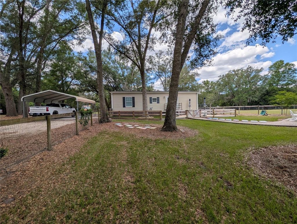 Photo of 6407 NW County Road 235, Alachua, FL 32615 (MLS # GC539627)