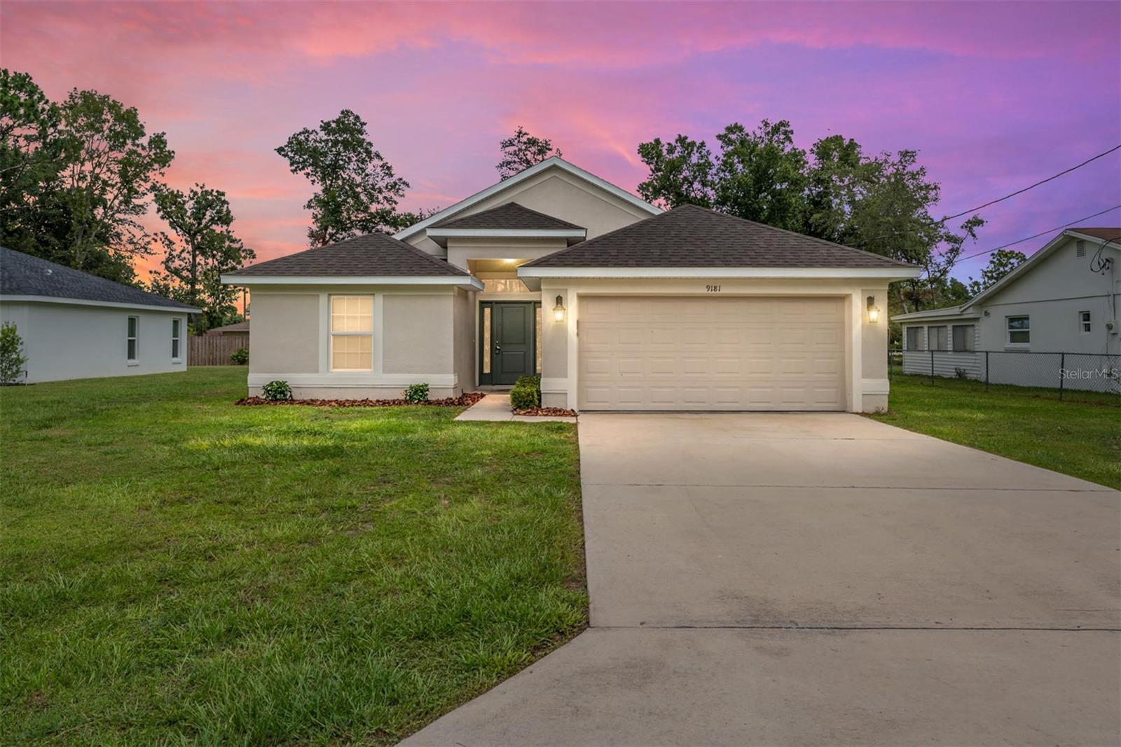 Orange Blossom Hills. Highly desirable area near The Villages. Better than new pricing, with new higher end updates! No HOA, NO age restrictions. 2020 Built, 4 bedroom, 2 bath home with 2 car attached garage. Split bedroom floor plan with great flow, offering 1,635 sq ft of living space. Brand new quartz countertops with upscale Blanco brand sink in ebony with veggie strainer. Brand new luxury vinyl plank flooring throughout. New ceiling fans and fresh paint throughout. Stylish 6 panel doors. Master bedroom boasts trayed ceiling with ensuite bath featuring dual sinks and spacious walk in shower. Garage floor is also sporting new epoxy finish. Partially fenced large back yard with a rear patio. Lots of room for you to personalize this space to your own haven. Compare this highly desirable 4 bedroom floor plan to neighboring new construction. Room sizes are approximate.