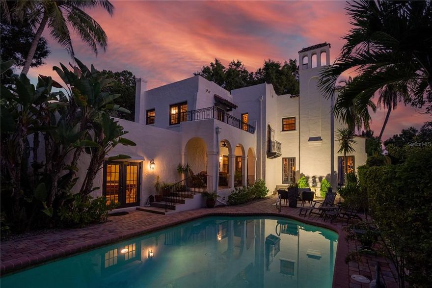 This grand estate, dubbed ’The Spanish Castle’ by acclaimed builder Samuel Schooley in 1920, is located on nearly a full acre in Old Pasadena.  Old world walls, covered in creeping fig, encompass the stately gardens, pool and fountain courtyards, an alfresco dining area, 3 car garage, and gated parking, providing unabridged privacy. At the center of the estate is a historic 5,374 sf, 4 bedroom, 4 bath home where every detail has been meticulously maintained and upgraded to suit modern life.  Upon entering the foyer, you’re welcomed with natural light flowing abundantly throughout the home.  Timeless architectural details have been thoughtfully woven together with all of the modern-day amenities expected in a luxury home. Along with high beamed ceilings, arched windows and doors, crown moldings, and exceptional oak floors are a few little surprises; a vintage telephone room, an apothecary cabinet, and stained-glass accents which add to the charm this home exudes.  Amongst the many modern upgrades are new AC systems, natural gas appliances, and custom Norman solar shades (partially motorized) installed throughout to improve energy efficiency. Entertain with ease from a formal living room with gas fireplace.  Move into to the discerning tasting room with extensive wine storage, which flanks the formal dining room with original Cuban tile floors, chandeliers, and French doors.  End your evening in the expansive billiards room with an antique wet bar, wood fireplace, and Saltillo tile floors. The newly remodeled kitchen, a masterpiece of design, offers both function and architectural consistency.  The statement piece, an 1880’s draper’s table from a silk factory in Lyon France, serves as the island.  The Viking appliance suite including a 48” range with grill, built-in refrigerator, and separate cold beverage storage.  Custom cabinetry was fabricated with furniture trim finishes and is accented by Danby Marble countertops, hand-painted terracotta backsplash, and solid, unlacquered brass fixtures.  It truly is a chef’s dream kitchen!  The remarkable checkered floor is hand-quarried marble and limestone from France and leads to a landing area presenting ancillary cabinetry and a coffee bar.  The expansive master suite comprises an entire wing and offers a private tea garden, wood-burning fireplace, his and her custom closets, and a large en suite bath. There is also access to a private balcony in the fountain courtyard. Located upstairs is the original master bedroom with wood-burning fireplace, 2 additional bedrooms, and 2 full baths.  It’s the perfect split floor plan for families and also great guest accommodations. There are so many additional unique details to share, which only a private tour of this majestic home can reveal.  Schedule your appointment today.