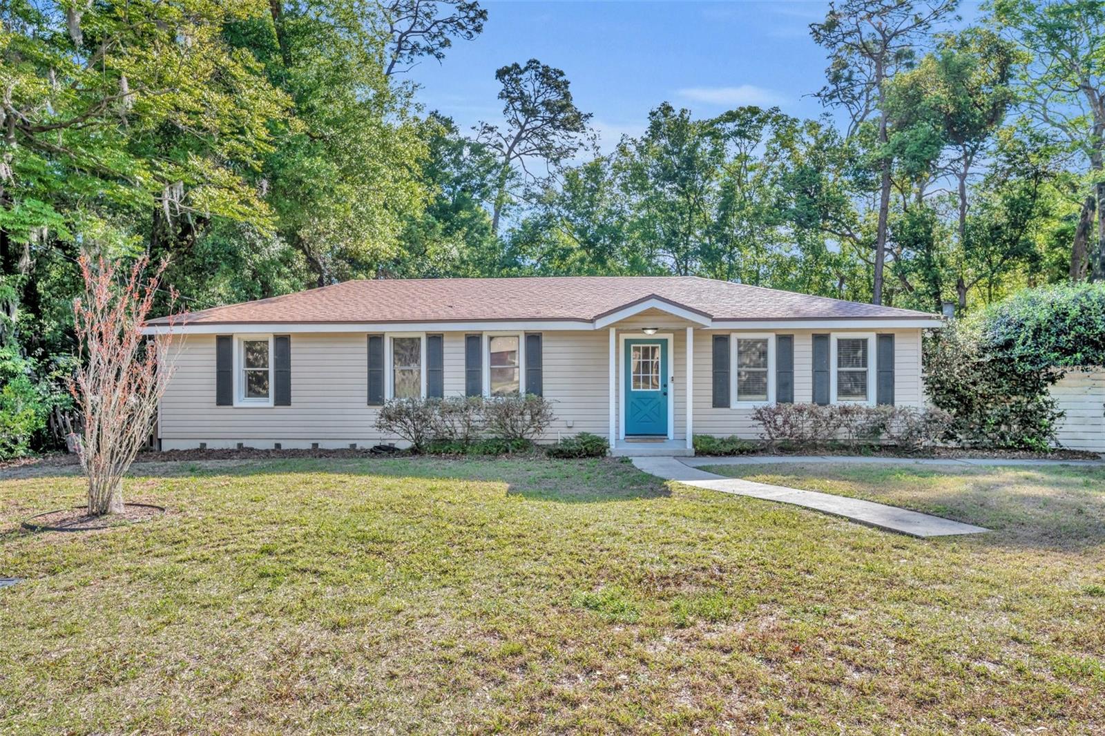 $3,000 BUYER CREDIT for closing costs or rate buy down! Discover this beautiful 4-bedroom, 2-bathroom home in a prime location! Boasting a spacious primary bedroom with a large walk-in closet! This home offers a versatile split floor plan and a bright, inviting living space. The kitchen is a chef’s dream, featuring newer appliances, a natural gas range with convection oven, and a large sink overlooking the expansive .38-acre yard. The fully fenced backyard oasis is shaded by mature trees, providing endless opportunities for fun and relaxation. Entertain in style with a tiki bar and outdoor kitchen, complete with a grill and wood-burning fireplace, perfect for intimate gatherings or large cookouts. Plus, enjoy an additional fire pit for cozy evenings under the stars! This oversized lot also includes a versatile 29’ x 55’ concrete slab, ideal as a sports court or for storing your boat, RV, or other outdoor toys. The detached garage features window A/C, insulation, and office space, making it the perfect workshop, studio, or creative retreat. Additional upgrades include a new roof (2023), HVAC system (2023), and a natural gas tankless water heater. Prime location! Just minutes from Stetson University, Historic Downtown DeLand, I-4 access, beaches, Lake Mary, Orlando attractions, and airports. Motivated buyers! Don’t miss out on this incredible opportunity—schedule your showing today!