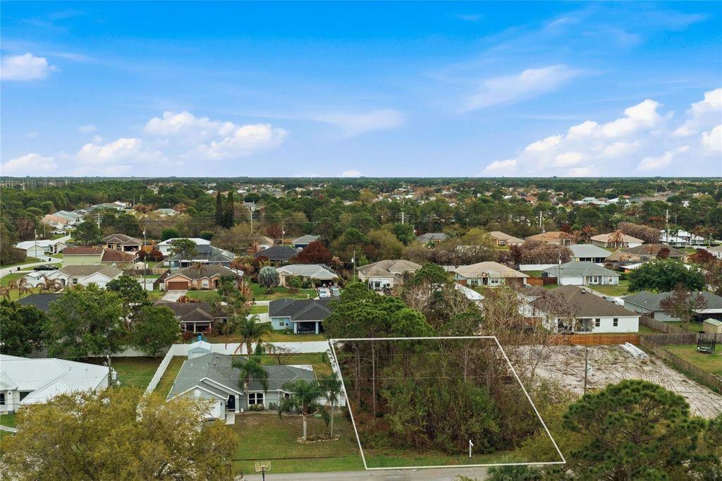 Photo of 6447 NW Hemlock St, Port Saint Lucie, FL 34986 (MLS # TB8489831)