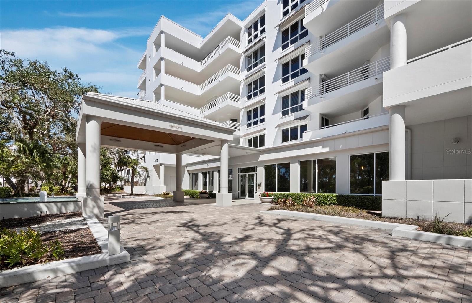 This exceptional 3-bedroom, 3.5-bathroom + family room residence, with 3,825 square feet of living space, is located within the gated Marina Bay community on Longboat Key, offering an ideal blend of privacy, comfort, and waterfront living. Arrive by private elevator into a welcoming foyer that opens to a spacious, light-filled layout. Wood floors and expansive glass walls frame stunning views of Sarasota Bay and the city skyline, creating a refined, relaxing atmosphere. The main living area flows seamlessly to a large wraparound terrace - perfect for entertaining or enjoying the bay. The updated kitchen features a center island, casual dining area, high-end stainless-steel appliances, and a stylish tile backsplash. Both guest bedrooms are en suite with private terrace access. The primary suite offers panoramic bay views, terrace access, dual walk-in closets, and a spa-like bath with a freestanding soaking tub, dual vanities, and a glass-enclosed shower. Additional features include 2 under-building parking spaces and a well-appointed laundry room and ample storage. Marina Bay is a gated, pet-friendly community offering exceptional amenities, including on-site management, a fitness center, library, tennis courts, pickleball and a heated resort-style pool. As part of Bay Isles, residents also enjoy membership to the Bay Isles Beach Club, a private Gulf-front retreat with gated parking, pavilions, grilling areas, restrooms, and seating to take in Longboat Key’s spectacular sunsets. Deeded beach access ensures a premier spot on the sand. For those seeking a resort-style experience, membership to the nearby Longboat Key Club is available, offering 45 holes of championship golf, world-class tennis facilities, a full-service spa and wellness center, waterfront dining, and the Longboat Key Club Moorings, with 291 deep-water slips and concierge services.