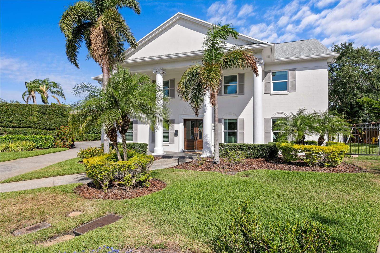 This 5 Bedroom, 3.5 Bathroom stately colonial on a Beach Park Isle cul-de-sac sits high and dry and is move-in ready with all of the updates and finishes you are dreaming of in your next home. The foyer entrance leads to a formal living room and a separate home office filled with natural light and newer windows throughout the home. The chef’s kitchen features a large island, high-end appliances including a standing wine fridge. The kitchen is open to a custom, built-in dining area with built-in bench and dry bar/buffet. Connected to a large butler’s pantry/laundry room/mud room and the family room, the home offers an open floorplan, with great storage and functionality. The family room has French doors leading to the private backyard with a pool, paver patio, covered seating area, a spacious backyard area and a putting green. The first floor also has a secondary primary, or guest suite with en-suite bathroom with a claw-foot tub, steam shower and walk-in closet. Upstairs, the primary bedroom has a spa-like bathroom with dual sinks and large custom walk-in closet. Three additional bedrooms on the second floor each have walk-in closets and shared bathroom. This home also features an attached garage with additional storage and new engineered wood flooring. This beautiful and quiet neighborhood is in close proximity to highways, schools, restaurants and shopping and Tampa International Airport.