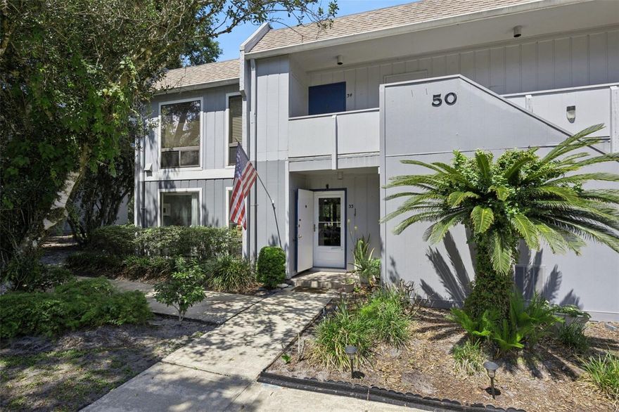 WELCOME HOME! This elegant, bright, and open first-floor, single-story 2-bedroom, 2-bath condo is located in the highly desirable Winter Springs community. From the moment you step inside, you’ll feel right at home in the spacious living and dining area featuring custom-built shelving and an inviting layout perfect for relaxing or entertaining. The split-bedroom floor plan offers added privacy, with sliding doors from the primary suite leading to a charming brick patio, ideal for enjoying your morning coffee or unwinding in the evening. The kitchen has been beautifully renovated with new appliances, updated countertops, and ample workspace. The primary bathroom features a walk-in shower with safety grab bars, while the guest bathroom includes a tub, with a convenient laundry area located in the guest bath closet. A bright and airy enclosed Florida room with A/C provides flexible space for a home office, reading nook, or additional living area. Step outside to your private patio with room for outdoor furniture, plants, or even your own garden retreat, all overlooking a peaceful wooded conservation area. Additional highlights include approximately 1,196 square feet including the enclosed porch, a newer A/C and water heater, fresh interior paint in a modern light gray, and no carpet throughout. Located in The Highlands, a quiet and friendly community offering a pool, tennis courts, parks, walking trails, scenic water views, reserved parking, and community mailboxes. HOA fees include high-speed internet, cable, pest control, and full grounds maintenance, with weekly lawn care and twice-weekly trash pickup. The home is situated in a top-rated school district with schools nearby and is just minutes from shopping, dining, and everyday conveniences. Schedule your private showing today, this one won’t last long!
