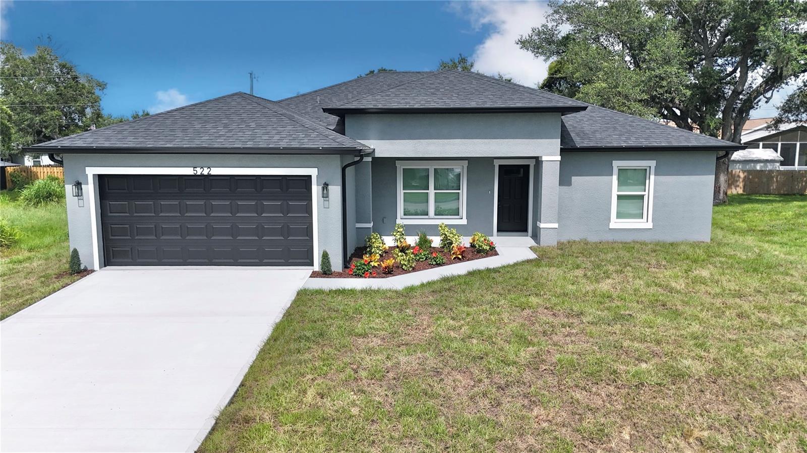 BRAND NEW - NO HOA home located in one of the most desirable areas of Port Charlotte!! This builder is offering a 2-10 Home Buyers Warranty which covers 1 Year Workmanship/ 2 Year Systems/ and 10 Year Structural!! This 1,842 square foot modern home features high impact windows, window blinds, water filtration system, rain gutters, 2 CAR Garage with openers, high ceilings with an open style floor plan that has 4 spacious bedrooms that include ceiling fans in all of the bedrooms and 2 full baths. Throughout the home you'll see Luxurious Vinyl Plank Flooring and beautiful Porcelain Tiles in the bathrooms. The kitchen features plenty of Wood Cabinetry along with Elegant Quartz countertops, Stainless Steel Appliances, and a Breakfast Bar. The kitchen flows effortlessly into the family room that has glass sliding doors that lead into the covered Lanai which is perfect for outdoor activities and entertaining! Conveniently located near hospitals, schools, shopping centers, I-75 & US-41. Short drive to the Charlotte Harbor and Historic downtown Punta Gorda where you’ll find waterfront dining & marinas! Close to beaches like Englewood, Venice Beach, and Boca Grande which is perfect for fishing! This BRAND NEW BLOCK CONSTRUCTION home sitting on a HUGE lot is ready for you to call it home!!