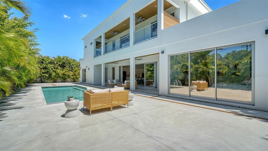 PRICE IMPROVEMENT | SELLER MOTIVATED. Now presenting a stunning new construction residence in Arlington Park, built by Courtyard Modern Development, where modern design, functionality, and Sarasota luxury lifestyle come together seamlessly. This exceptional two-story home offers 6 bedrooms, 7 full bathrooms, and approximately 3,574 sq ft of living space, thoughtfully designed to deliver both elegance and comfort in every detail. The first level welcomes you with an open-concept layout featuring a spacious living room, dining area, and chef-inspired kitchen, complemented by a walk-in pantry and dedicated laundry room. The primary suite is conveniently located on the main floor, offering privacy and comfort, complete with a large primary bathroom and large walk-in closet. Builder will design a custom closet configuration to reflect the future homeowner's personal needs. An additional guest bedroom with en-suite bath is also located on this level. In addition, enjoy the convenience of a full bathroom that opens to the pool area. The second level features four generously sized bedrooms, each with its own en-suite bathroom and large closets, providing ultimate privacy and convenience for family and guests. Step outside and experience true Florida living with a private pool and spa, expansive outdoor areas including a large covered balcony overlooking the pool, a planned outdoor grill space, perfect for entertaining or relaxing year-round. You will also enjoy the beautifully and thoughtfully designed landscaped  yard. Additional features include a 2-car garage and extended driveway. Zoned for the A-rated , this home is ideally located just minutes from Downtown Sarasota, Sarasota Memorial Hospital, Siesta Key Beach, and Southside Village. This is your opportunity to enjoy a home perfectly blending luxury, location, and lifestyle.