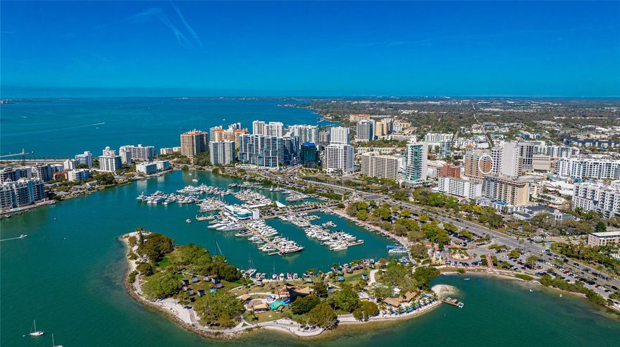 Welcome to 1350 Main, where luxury meets Downtown Sarasota living. Situated on the 12th floor, this stunning 2-bedroom, 2.5-bathroom corner unit spans over 2,288 sq. ft. Prepare to be captivated as natural light streams through expansive windows, unveiling breathtaking views of Sarasota Bay to the Gulf from every room. Step onto marble floors that grace the main living area, enhanced by crown molding throughout. The kitchen, a culinary haven, boasts European cabinetry, high-quality granite countertops, and an oversized walk-in pantry, beckoning culinary enthusiasts to unleash their creativity. Open the pocket sliding glass door to reveal the first of two balconies, offering a tranquil spot to savor morning serenity or toast to unforgettable sunsets. Indulge in unparalleled luxury within the primary suite, where hardwood floors, a private balcony, and a separate AC system await your pleasure. Immerse yourself in lavish comfort with a custom office space, deluxe walk-in closet, and an exquisite ensuite bathroom. A second bedroom and bathroom provide a welcoming retreat for guests, while a laundry room with extra storage ensures convenience at every turn. At 1350 Main, a 24-hour on-site concierge stands ready to fulfill your every desire in the lobby. Secure garage parking with additional storage, available guest suites, and an array of amenities including a state-of-the-art fitness center, social rooms with bars and televisions, and a conference room elevate your living experience to extraordinary heights. Live like you're on vacation with access to the spacious recreation deck, complete with grills, a heated pool, and a spa. Embrace the vibrant energy of Downtown Sarasota, where fine dining, shopping, and cultural experiences await just steps from your door. Whether strolling through the Farmer's Market, crossing the iconic John Ringling Bridge, or immersing yourself in Sarasota's rich arts scene, each day presents new adventures and discoveries.