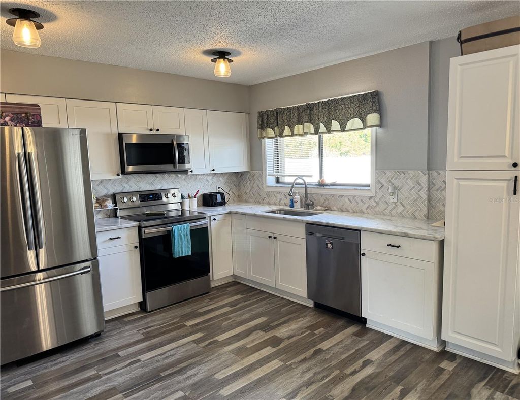 Photo of 2426 Baird Street, Port Charlotte, FL 33948 (MLS # C7519902)