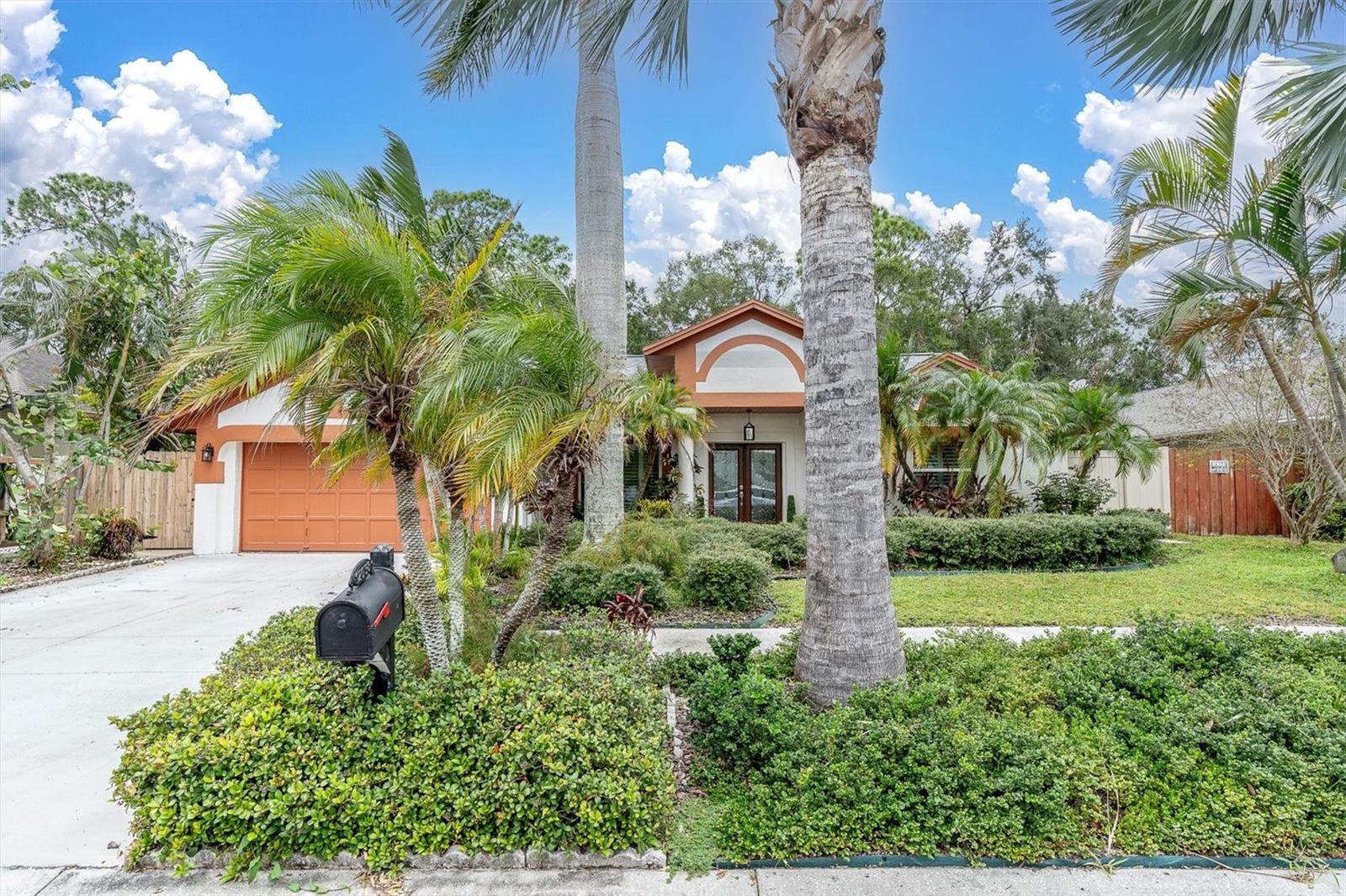 Don't miss your chance to own this stunning 3-bedroom, 2-bath pool home located in a desirable Tampa neighborhood! Featuring nearly 2,000 sq. ft. of well-designed living space, this home offers a bright and open floor plan with vaulted ceilings and no carpet—only tile and luxury vinyl plank flooring throughout.
The oak and granite kitchen is a showstopper, complete with a breakfast bar, stainless steel appliances, and a pass-through window to the pool area—perfect for entertaining. The kitchen flows seamlessly into the family room, anchored by a floor-to-ceiling stone wood-burning fireplace, creating a cozy gathering space year-round.
Enjoy the ideal split bedroom layout with a private primary suite featuring direct access to the lanai, dual vanities, soaking tub, and separate shower. The two additional bedrooms are spacious, with a guest bath that includes dual sinks and a tub/shower combo.
Step outside to your personal oasis: a screened pavered lanai, heated pool, and spa with spillover waterfall, all surrounded by lush landscaping, mature tropical palms, and a full sprinkler system.
Recent upgrades include brand new windows and exterior doors, new A/C, pool heat pump, and hot water heater, 3D architectural shingle roof, new exterior paint and pavers, and beautiful tile and LVP flooring throughout.
Enjoy Florida living at its best—cool summers by the pool and cozy winters by the fireplace. Convenient access to shopping, dining, and major highways. Schedule your showing today—this one won’t last!