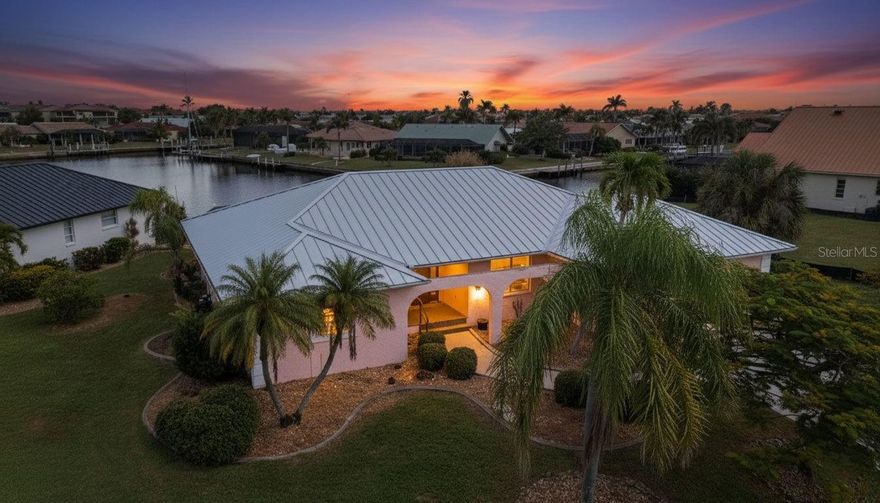 One or more photo(s) has been virtually staged. INCREDIBLE VALUE in this PGI canal home - nearly 2,000 sq ft - metal roof - large pool/lanai and stunning views of intersecting canals - with a 5 minute ride out to Charlotte Harbor (no bridges - great Sailboat lot).  On a cul-de-sac location and easy access to Fisherman village and downtown Punta Gorda.  Step inside this home and you are greeted by a living room that opens to the large lanai/pool and that million dollar view. Access lanai/pool from master bedroom - living room - kitchen - guest bedroom/bathroom.  Sensational water views from nearly every room of this house.  Family room connected to kitchen provides great opportunity for second TV room or office.  Split floor plan has guest bedrooms/bathroom off the family room with the master bedroom off the living room - providing great privacy for both you and your guests. No question though - the jewel of this house is the cul-de-sac location coupled with the easy out to Charlotte Harbor - just a 5 minute ride.  Concrete dock already in place.  Better hurry - someone is going to get a bargain.