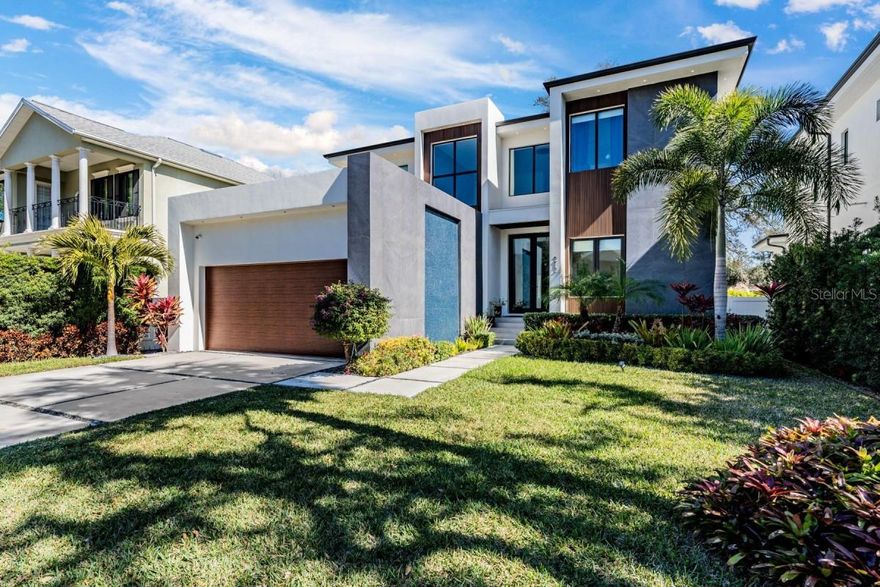 Exquisite Custom-Built Estate in South Tampa's Coveted Beach Park Experience unmatched luxury in this story block custom home, perfectly positioned in Beach Park, one of Tampa's most prestigious neighborhoods. Just minutes from Tampa International Airport, International Plaza, and the city's best dining and entertainment, this residence offers the ultimate blend of sophistication and convenience. Master bedroom first floor, This one-of-a-kind home features four expansive bedrooms, four elegant bathrooms. The interiors are a testament to modern elegance, with 48x48 porcelain floors and luxurious porcelain countertops that surpass the finest quartz alternatives. The gourmet kitchen, outfitted with high-end Dacor appliances and custom cabinetry, is both stylish and functional. Designed for grand entertaining and intimate gatherings alike, the open-concept living space showcases an illuminated glass wine display creating a stunning focal point. Flooded with natural light, this home seamlessly blends indoor and outdoor living. This property isn't just a home, it's a lifestyle of comfort, elegance, and exclusivity. Don't miss your opportunity to own this rare gem in Beach Park. Schedule your private showing today.