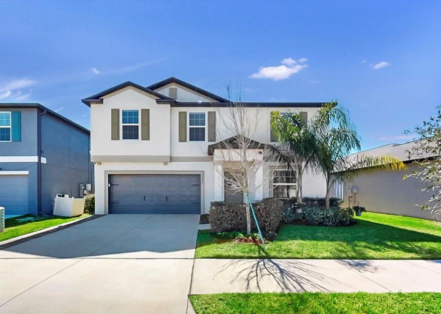 Exciting news! Discover this stunning Triple Creek home, featuring a 4.25% assumable VA loan—an exceptional opportunity for buyers. With 4 spacious bedrooms, 2.5 bathrooms, and a versatile loft, this residence blends comfort and modern living. The appliances are covered by the manufacturer's warranty for added peace of mind.

Situated on a fully fenced, oversized waterview lot, this home welcomes you with a bright, open, and beautifully decorated interior. The kitchen and living room feature open shelving, classic cabinetry, ample storage, and a large pantry. A window over the kitchen sink provides lovely views of the fenced yard and water, filling the space with natural light. Downstairs, a spacious flex room—currently used as an office—offers endless possibilities, while the built-in storage nook in the entryway doubles as a convenient drop zone, adding a charming farmhouse touch. A discreet staircase leads to the second floor.

Upstairs, the owner's suite boasts serene water views, a walk-in shower, a double vanity, and an oversized closet. All bedrooms and the laundry room are thoughtfully located upstairs, along with a versatile loft ideal for gatherings, homework, exercise, or movie nights. The pristine garage features abundant storage and durable epoxy flooring, and the back patio is finished with oversized pavers, a large yard—perfect for outdoor entertaining. 

Triple Creek presents miles of scenic walking trails, three resort-style pools, tennis and basketball courts, playgrounds, and a dog park. Experience a vibrant community with frequent events and weekly food trucks. This prime Riverview location provides effortless access to I-75, Tampa Bay, boating, restaurants, shopping, and world-class beaches that are truly unbeatable.