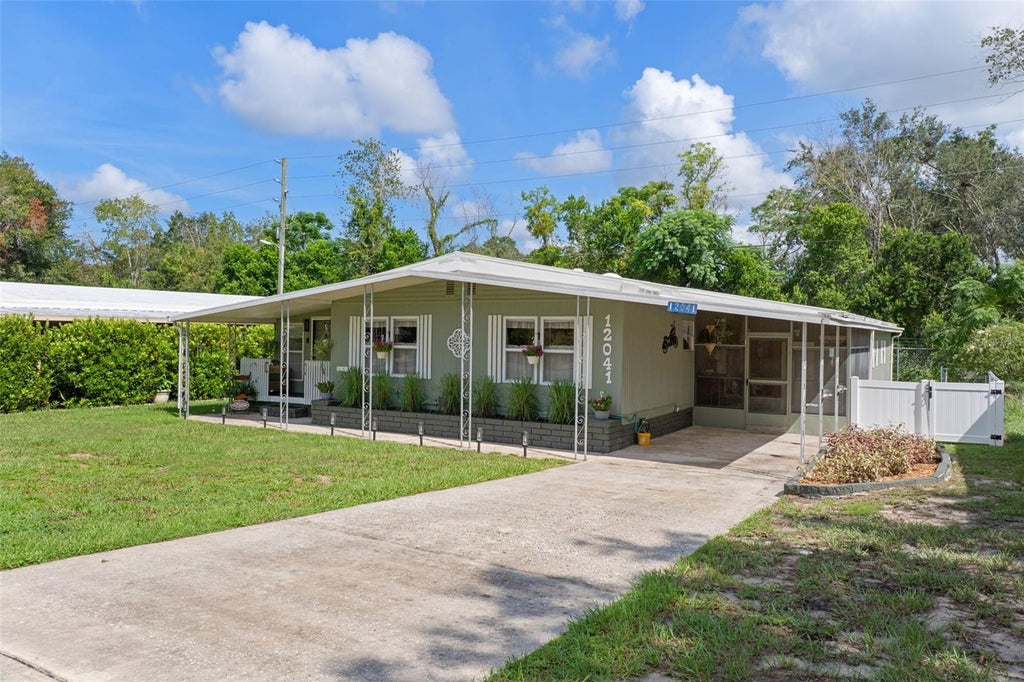 Photo of 12041 Fairway Avenue, Brooksville, FL 34613 (MLS # TB8543694)