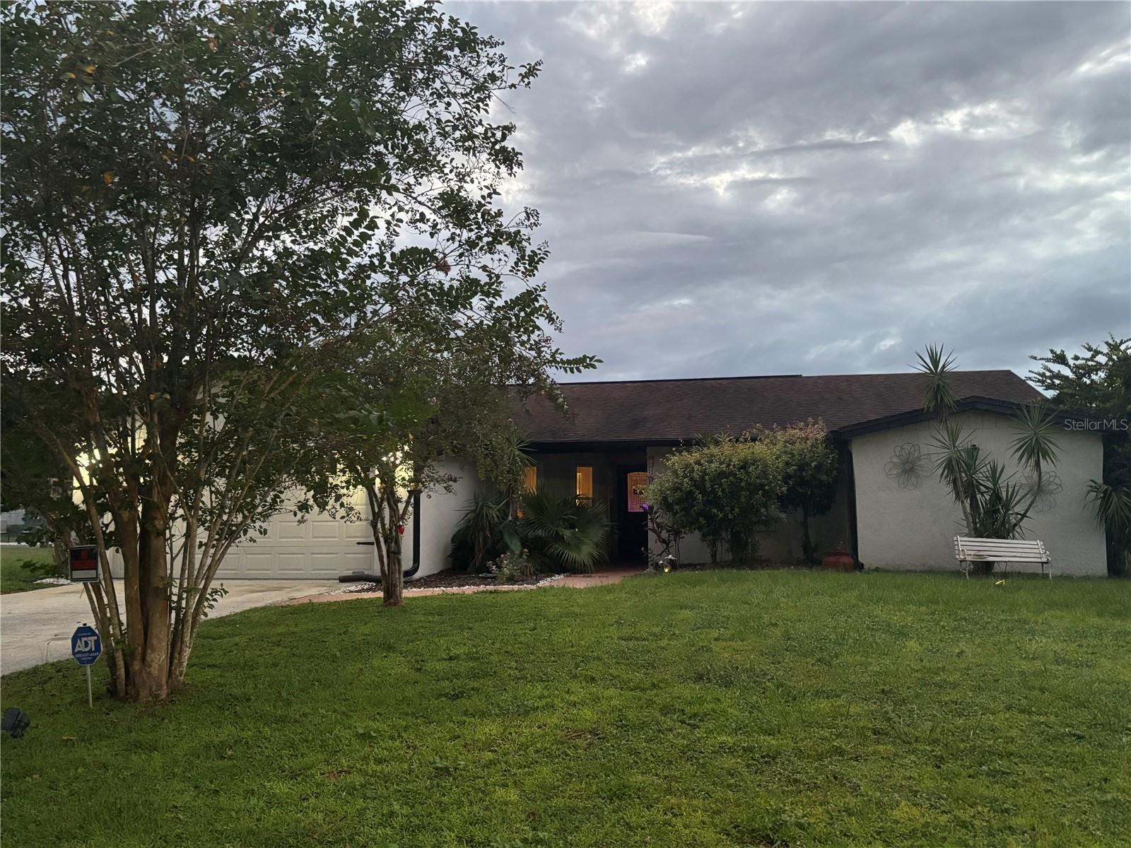 Investor alert, in need of some repairs but nothing major to add personal touches. Charming primary home, 2nd home or rental investment property offering affordable Central Florida Living. Low HOA includes internet and cable. Enjoyment of the pool and fitness center is optional. Solar panels savings on monthly electric bill can cover the cost of property taxes. It is conveniently located close to amenities such as the Poinciana Medical Center, which is 7 minutes away and the Promenade at Poinciana – anchored by Publix, with shopping, dining, and other daily conveniences. In addition, it is only 12 miles away from the Poinciana SunRail station connecting travelers to MCO and 9 other cities in Central Florida: Orlando, Winter Park, Maitland, Altamonte Springs, Longwood, Sanford, Lake Mary, Debary and Deland.
The kitchen and bathrooms have been upgraded and there is still room for personal touches.
Four cameras surveillance system for convenience and peace of mind. Custom lighting in the common areas and the electric built in fireplace for ambiance. New windows, sliding door, gutters and A/C ducts. The roof and the water heater are 7 years old and water softener system is 5 years old. The huge enclosed patio is ideal to relax and entertain while enjoying the Florida sunsets with no rear neighbor. The future owner may decide to keep the pond or build his/her own pool.
Listing agent will be glad to answer any questions and schedule a showing for you. Request your showing.