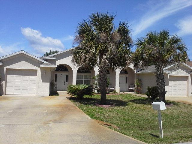 Welcome home to this adorable duplex with a spacious floorplan that includes 2 formal living areas that can be used for dining room, playroom or office. The front porch will be great for morning sunrises and coffee. Low maintenance ceramic tile throughout living areas and open kitchen concept overlooking the living room area. High arch window to let the Florida rays shine through. Bar top counters are perfect for when guests come visit. Expanded oversized driveway offers plenty of parking for when out of town guests visit. Screened porch and lawn maintenance is included in the rent. Come see why so many have already made Palm Coast home.