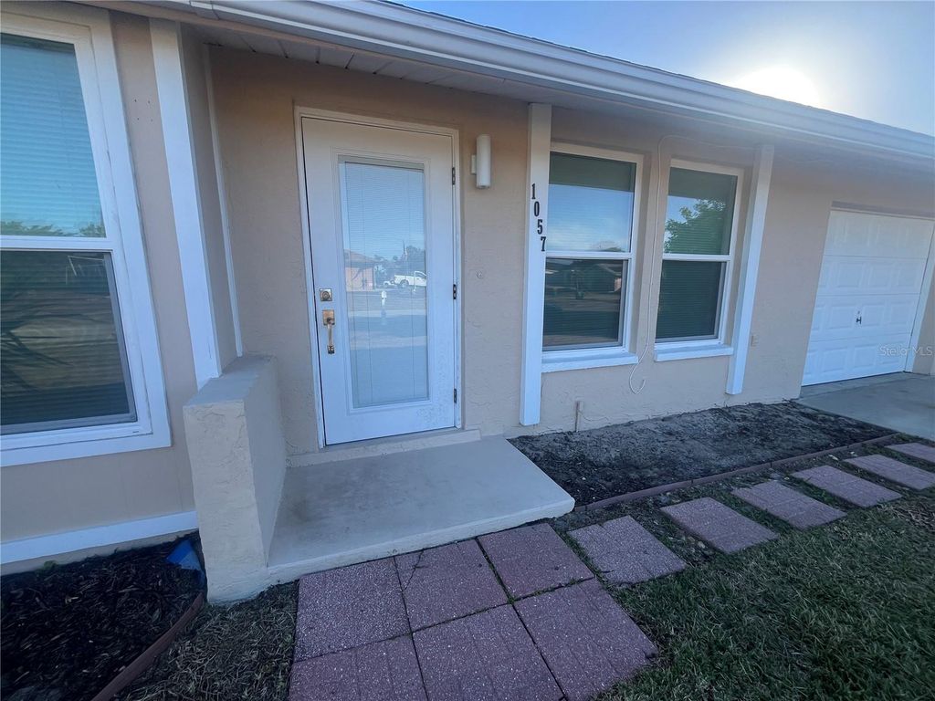 Photo of 1057 Tropical Avenue NW, Port Charlotte, FL 33948 (MLS # C7520963)