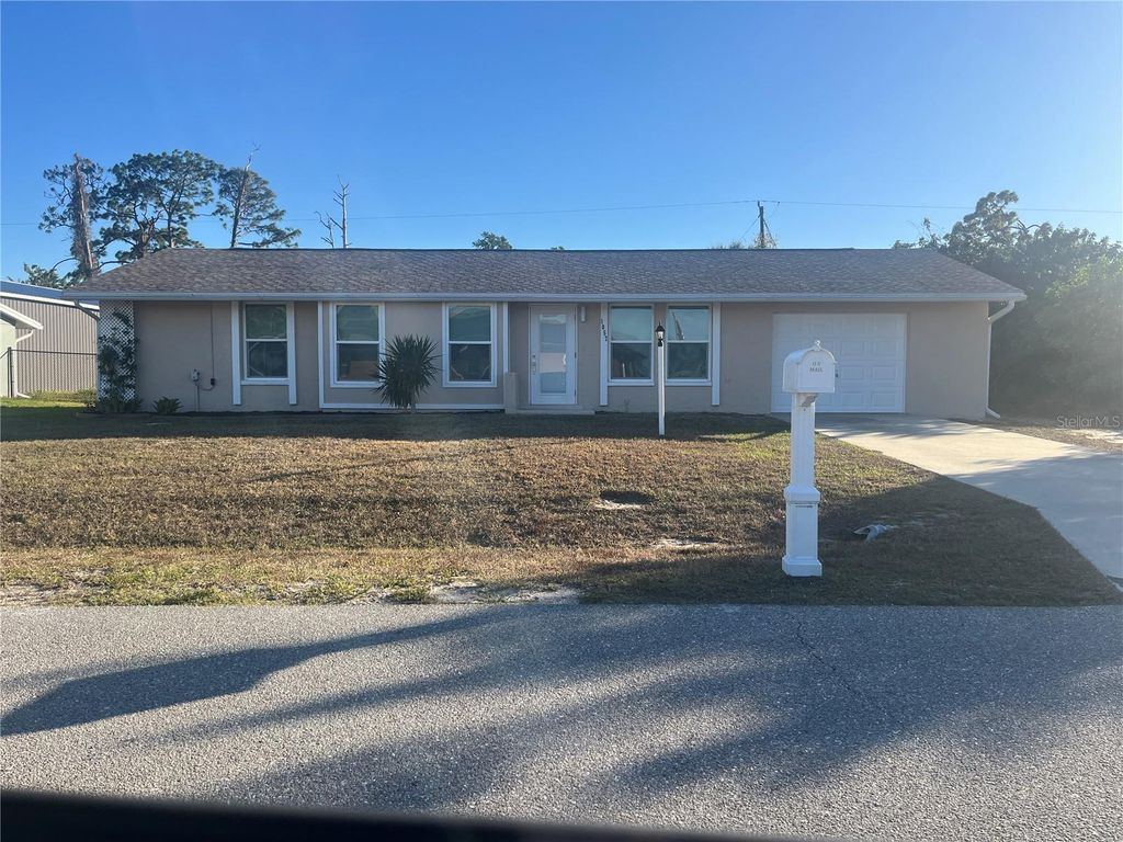 Photo of 1057 Tropical Avenue NW, Port Charlotte, FL 33948 (MLS # C7520963)