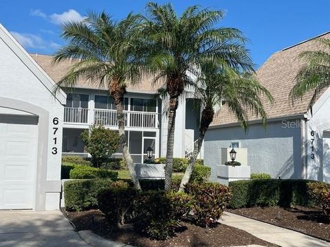 Photo of 6713 Stone River Rd #203, Bradenton, FL 34203 (MLS # A4677191)