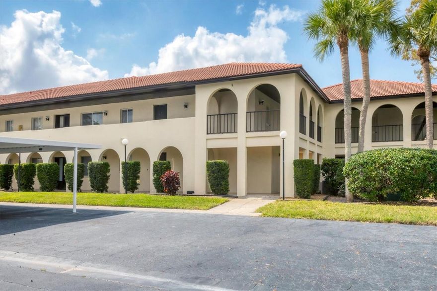 NO DAMAGE OR FLOODING TO UNIT OR BUILDING FROM HURRICANES OR STORMS. The cutest PET FRIENDLY Sarasota condo bursting with charm. Come relax and enjoy MAINTENANCE FREE LIVING while having peace of mind knowing MAJOR UPDATES include the KITCHEN AND BATHROOM, AC, THERMOSTAT, AIR SCRUBBER, APPLIANCES, WATER HEATER, STORM DOOR, lighting, tub fixtures, and interior paint. This 1st floor unit is FULLY UPDATED on the inside and has the best garden view from the lanai. Constructed to easily make this a 2 bedroom by adding a wall to close off the bonus room. This adorable condo offers ceramic tile throughout, a kitchen with granite counters, beautiful wood cabinetry and stainless steel appliances. The extra large primary bedroom has a walk-in closet, the living room has sliders to the lanai, the tasteful and neutral bathroom has a linen closet, and an abundance of natural light shines through the entire space. The spacious lanai is equipped with a screen wall and has a roomy storage closet. A covered carport is included and the laundry room and storage room are only a few steps away. This lively 55 plus community has an active clubhouse with a monthly calendar of activities, heated pool, fitness center, sauna, pickleball court, shuffleboard, library, billiards room, yoga, bbq grilling area, bingo, cards, socials, and more! Less than a mile from Publix, Walmart Neighborhood Market, banks, shopping and dining. The Legacy Trail is located 1 mile from the condo and there is only a short drive to Siesta Key Beach, downtown and I75. You may purchase and rent the unit immediately which makes for a great investment property. Monthly condo fee is $531 and also includes cable & high speed internet, pest control, grounds maintenance.