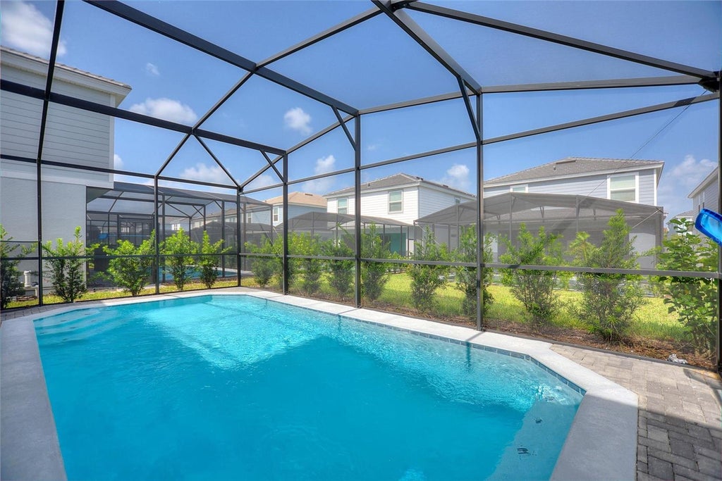 Photo of 7384 Oakmoss Loop, Davenport, FL 33837 (MLS # O6436661)