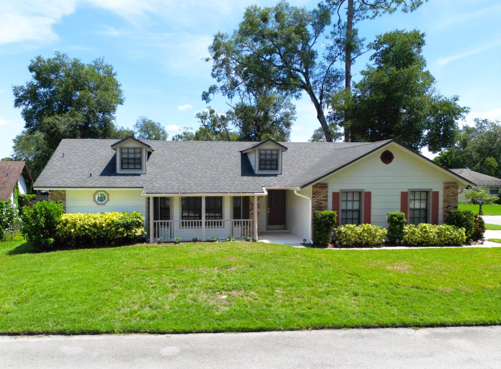 Welcome to this Charming, Beautifully Maintained 4-Bedroom, 2-Bath POOL Home located in the picturesque Longwood Green community—right in the heart of Longwood. Nestled on a lushly landscaped corner lot with brand-new sod, this home exudes warmth, character, and pride of ownership. Step inside and be greeted by rich wood flooring in the inviting Family Room, complete with a cozy brick wood-burning Fireplace—perfect for relaxing evenings. The adjacent Kitchen is a delight, featuring granite countertops, tile backsplash, stainless steel appliances, a large closet pantry, and a sunny Dinette Area with French doors leading out to the Lanai and Pool. Entertain with ease in the spacious formal Living and Dining Rooms, ideal for gatherings and celebrations. The split-Bedroom floor plan offers privacy and comfort, with a generous Master Suite boasting wood floors, French doors, a walk-in closet, and a private En-Suite Bath. On the opposite side of the home, you will find three additional Bedrooms, a pool-planned full Bath, and a convenient indoor Laundry Room. Outdoor Living at Its Finest as you enjoy the Florida lifestyle on the expansive covered Lanai (30' x 14'), complete with a wet bar, wine fridge, and ceiling fan, all overlooking the Screened-in sparkling Pool and Spa. The backyard also features a paver patio, storage shed, and beautiful landscaping for added charm and functionality. Recent Updates Include: Interior & Pool Deck Paint (2025), Electrical Panel (2024), Pool Pump (2024), Full Home Security System & Cameras (2022), Roof (2020), French Doors in Dining Room & Master Bedroom (2020), AC Unit (2019), Water Heater (2019) & much more. Prime Location located in a fantastic neighborhood with top-rated schools, just minutes from Historic Longwood, Lake Mary, and a variety of restaurants, shops, medical facilities, and hospitals. Easy access to both I-4 and SR 417 makes commuting a breeze. This home truly has it all—space, style, updates, location & it is MOVE-IN READY. Do not miss your chance to see it in person.