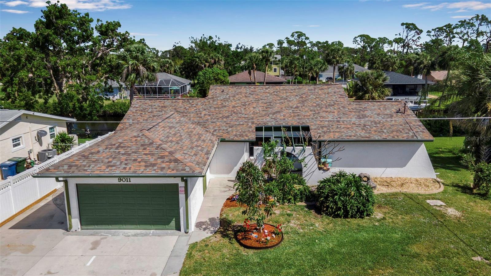 Step into your slice of WATERFRONT PARADISE!!! This beautifully updated 2 bedroom, 2 bath home with a 2 car garage is perfectly situated along the serene Myakka River, offering direct access to the Gulf of America. One of the few properties in the area featuring a 30,000 lb BOAT LIFT and private DOCK, which was recently re-decked, making it the ultimate haven for boating and fishing enthusiasts who want to enjoy the Florida lifestyle year round. Step inside to an open and inviting living room with soaring vaulted ceilings, flowing seamlessly into the dining area featuring a CUSTOM built-in bench with storage. The kitchen is conveniently located just off the dining room and offers stainless steel appliances, ample cabinet space, and a brand NEW dual stainless steel sink and faucet. The master suite is thoughtfully set apart for privacy, with its own ensuite bathroom and a walkout to a PRIVATE screened in patio overlooking peaceful river views. A bright and airy Florida room with IMPACT resistant glass windows provides the perfect setting to unwind and enjoy stunning sunsets over the water. An additional 600 sq ft family/media room has been added, which could potentially be used as a third bedroom/mother-in-law suite, features a mini split A/C system for comfort year round, plus an adjoining utility room for added storage. The second bathroom has been fully UPDATED with NEW flooring, a stylish vanity, and a charming clawfoot tub. The home also features a spacious laundry room with upper and lower cabinets and a utility sink for added convenience. Recent upgrades include a NEW ROOF, a whole house KINETICO water softener system with a 300 gallon tank, a plug-in 8750 watt Predator GENERATOR, fresh paint, hurricane shutters, and a backyard filled with fruit trees. Best of all, this peaceful neighborhood has NO HOA fees and is bordered by Myakka State Forest, protecting it from overdevelopment and preserving the natural beauty that surrounds it. The home has weathered multiple hurricanes WITHOUT any water damage or flooding. Don’t miss this RARE opportunity to own a turnkey waterfront home in one of the most tranquil settings on Florida’s Gulf Coast.