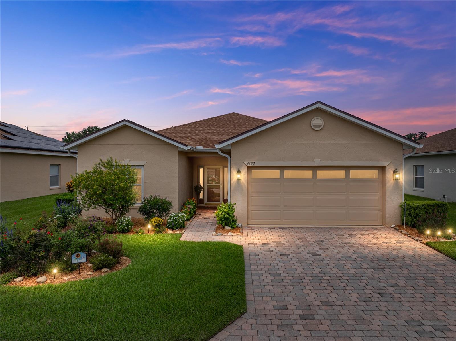 Under contract-accepting backup offers. Pride of ownership is evident in this ready-to-move-in, one-owner Caribbean floor plan 2 bedroom/2 bath home. The owners have updated the home during their ownership and made this a must-see. This home is situated on a pond-frontage lot on a street that terminates in a cul-de-sac. The quality landscaping, paver driveway and walk add to the curb appeal. The landscaping is watered by an automated irrigation system that is supplied by a separate meter, a real money saver. A new roof was installed in 2021, along with full house rain gutters. The covered front entry and storm door protect the entrance. Screen inserts can be installed in the screen door. Both sides of the front door have glass sidelights that allow natural light into the welcoming foyer. Once inside the home, the foyer leads to the living room. This open floor plan revolves around the living room. To the right is the kitchen and dining room. To the left are the guest and primary bedroom suites. At the end of the living room is the enclosed Florida room/lanai. The living room has ceramic tile flooring, a designer ceiling fan with light, and a triple slider that opens to the Florida room/lanai. The kitchen features granite counters, ample cabinetry with crown molding, luxury vinyl plank flooring, a solar tube for natural light, a closet pantry, and upgraded fixtures. All the appliances stay. The kitchen has a wrap-around snack bar, the perfect place for those casual meals. Also in the kitchen is the laundry closet, which also has additional cabinetry. The washer and dryer stay with the new owners. The kitchen also has a fire-rated door to the attached two-car garage. The garage has a service door and gets natural light from the extra window and the windows in the garage door itself. A pull-down attic ladder makes it easy to access the attic space. The remote-controlled garage door opener is a plus. At the other end of the kitchen is the dining room. The dining room has a double slider that opens to the Florida room/lanai. The Florida room/lanai is enclosed with slider glass windows, has ceramic tile flooring, and a ceiling fan with light. Although this space is very usable, its square footage is NOT included in the stated size of this home. The guest suite is at the front of the home in the west wing and has a pocket door that can be used to isolate this area from the rest of the home. The guest bedroom has faux wood laminate flooring, a ceiling fan with light, and a large reach-in closet. The adjacent guest bath features a combination tub and shower with a ceramic tile surround, an elongated stool, an elevated vanity with a Corian counter, upgraded lighting and plumbing fixtures, and a linen closet. The primary suite is located at the rear of the home and features a large bedroom, a walk-in closet, a reach-in closet with mirrored bifold doors, a ceiling fan with a light, and a luxury vinyl plank floor. The primary bathroom features a stall shower with a built-in seat, a ceramic tile surround, an elongated stool, an elevated vanity with two sinks on a Corian countertop, and a window. Recently, replacement triple-glazed slider-style windows were installed in the dining and primary bedroom. Double-glazed windows were installed in the rest of the home. This quality Lake Ashton Golf Club home is aggressively priced and will not last long. Here is your chance to live in Central Florida's premier 55 + gated and guarded resort-style living community with lots of amenities to enjoy.