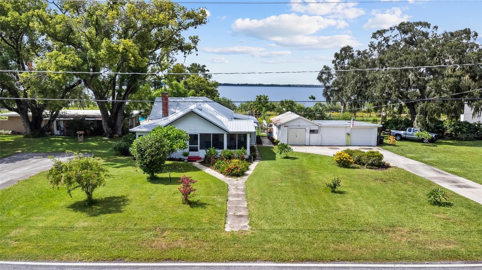 Charming Lakeview Bungalow with Pool on .6 Acre in Lake Alfred, FL
Welcome to this charming 2-bedroom, 2-bathroom bungalow perfectly situated on a generous .6-acre lot with beautiful views of Lake Alfred. This home also offers a flexible bonus room—perfect for a third bedroom, home office, craft room, or hobby space.
Step inside and enjoy a light-filled, open layout that flows into a lovely front porch—ideal for sipping morning coffee or relaxing with lake breezes. Outdoors, the sparkling in-ground chlorine pool is ready for year-round enjoyment, creating your own Florida backyard oasis.
Additional features include a 2-car garage, an attached workshop for storage or projects, and a covered porch with a built-in outdoor kitchen—perfect for entertaining family and friends.
With its spacious yard, versatile living areas, and prime location near the water, this home combines small-town charm with modern amenities. Located close to downtown Lake Alfred, shops, dining, and parks, with easy access to Winter Haven, I-4, and Orlando attractions.
Don’t miss the opportunity to own a pool home with lake views in sought-after Polk County—schedule your private tour today!