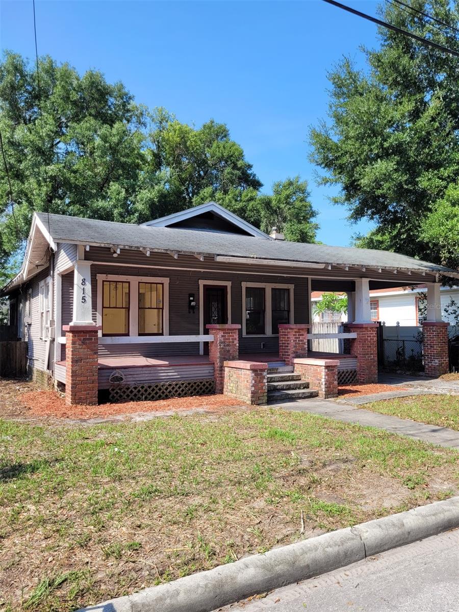 *Investor Special* This 4 bedroom, 2 bathroom bungalow located in Southeast Seminole Heights is just what you've been looking for! Plenty of charm with the covered front porch, fireplace/built-in shelves and cabinets, hardwood floors, vintage tiling in the bathroom, and a spiral staircase leading to a small loft in the back bedroom.
Home re-piped including sewer line, New water heater, Termite treatment, and Front porch repair/replacement all in 2021. Needs siding repairs/replacement, subfloor/joist repair, cosmetic items, and misc repairs. No reported roof leaks.