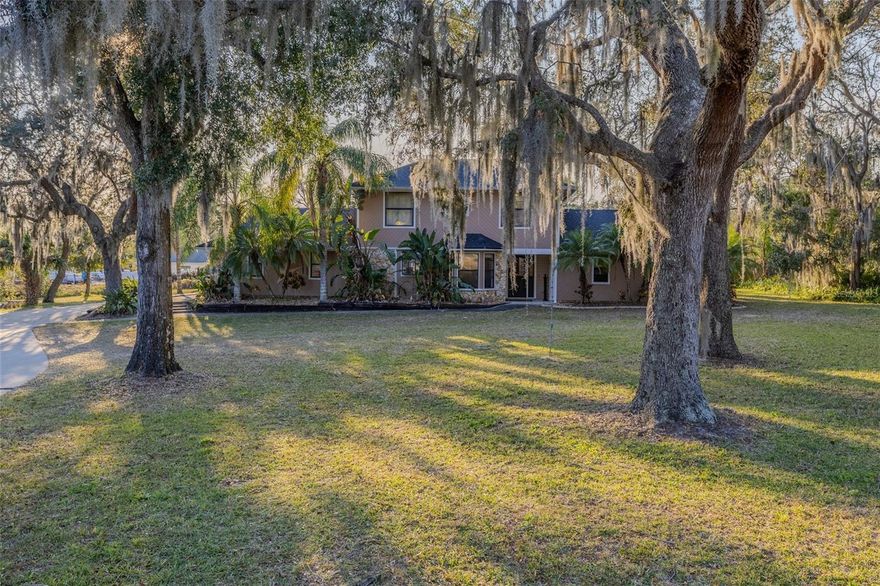 An Outstanding Opportunity in Port Orange! Location, Location, Location! This partially renovated 4-bedroom, 2.5-bath home offers over 2,100 sq ft of living space and sits on more than an acre of high, dry land with no flooding history. Many updates have been done, including some crown molding work, interior painting, flooring upstairs, new carpet, and a new roof installed in April 2023, giving the next owner the perfect chance to finish the remaining updates needed and to and build some instant equity. The property features a 600 sq ft, 2-car garage, abundant parking, and ample room for a boat, RV, or other toys—no HOA to restrict you. Enjoy the screen-enclosed saltwater pool with sundeck and spa or take in beautiful sunsets over the creek from this private, centrally located parcel. Ideally situated just 4 miles from the beach, with convenient highway access and within the Spruce Creek High School district, this home delivers an unbeatable combination of space, location, and potential. A rare find you won’t want to miss! All information is deemed reliable but not guaranteed.