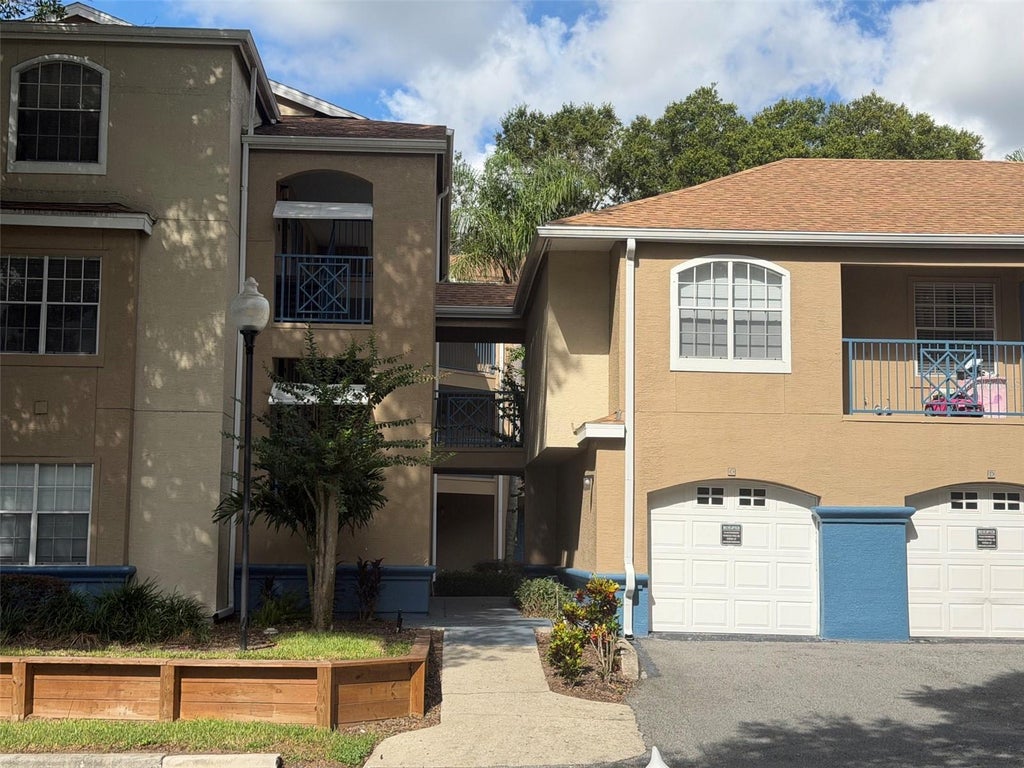 Photo of 7250 Westpointe Boulevard #1022, Orlando, FL 32835 (MLS # O6441104)