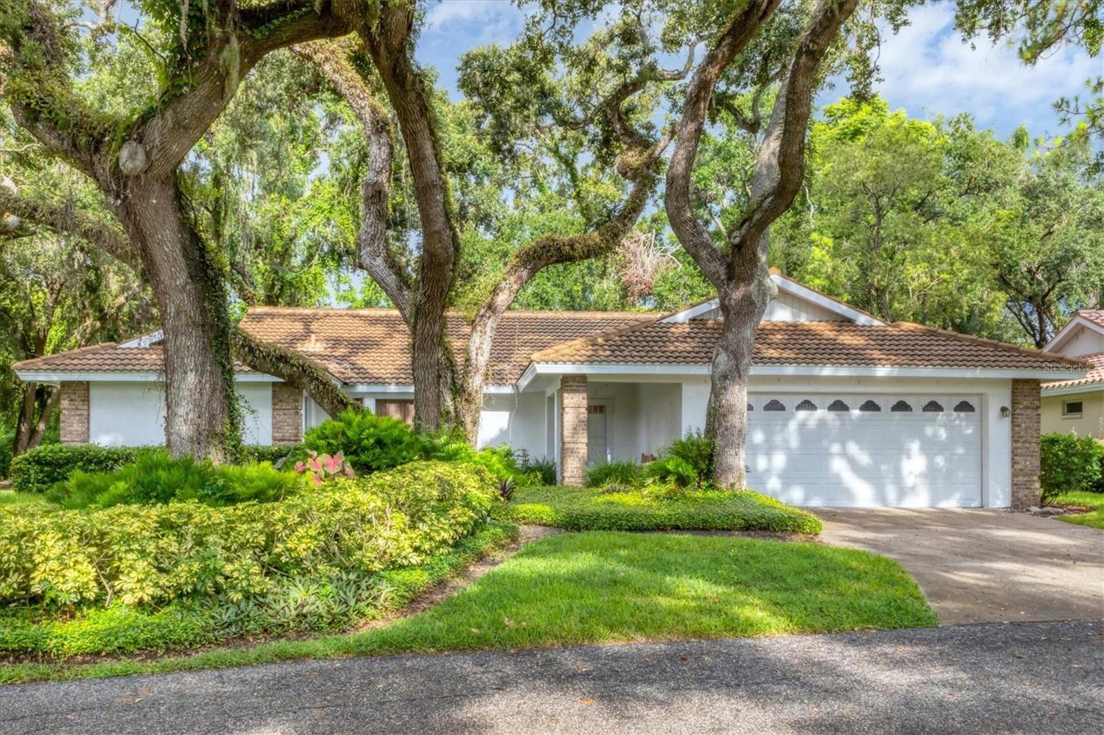 Discover the perfect blend of comfort, style, and community in this beautifully maintained 3-bedroom, 2-bath single-family home, tucked within the picturesque, gated enclave of Garden Lakes. This free-standing residence offers the ease of maintenance-free living paired with the privacy and charm of a traditional home. Step inside to the spacious living and dining areas flowing seamlessly into a versatile Florida room—ideal for a home office, hobby space, or quiet retreat. The well-designed layout makes everyday living and entertaining a breeze. Outside, you’ll love the oversized, landscaped courtyard surrounded by mature oak trees—a peaceful spot for your morning coffee or evening unwind. Garden Lakes is known for its serene, tree-lined streets and resort-style amenities, including a heated pool, modern clubhouse with kitchen, fitness center, library, tennis, pickleball, shuffleboard, and scenic walking paths. With a vibrant calendar of social events, it’s easy to feel right at home in this friendly, active community. Centrally located near top shopping, dining, and entertainment—just minutes to University Town Center, Sarasota’s cultural attractions, medical facilities, and the sparkling Gulf Coast beaches—this home is truly a gateway to the Florida lifestyle you’ve been dreaming of. Don’t miss this opportunity to own a slice of paradise—schedule your private tour today!