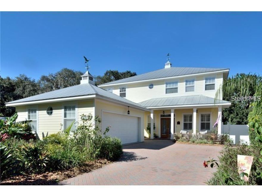 Picture Perfect KEYWEST style Gated home with all the charm of a Hemingway novel.Situated on the waterfront of the Hillsborough River, walkway to private dock surrounded by lush landscaping..Currently the home has spacious Three Bedrooms, 3.5 Baths with Two Master Bedrooms (downstairs and upstairs).Stunning wood planked hi-gloss oak floors throughout the entire home, tile in the baths. High ceilings draw your eyes up to the transom windows and crown molding.Indoor and outdoor surround sound Bose speakers Wrought Iron detailed railing leads to the balcony, bedrooms and laundry room. Custom paint color blocked per room! Kitchen features solid wood raised panel cabinets, granite counters, gas Jenn-Air 5 burner range with double oven, stainless steel appliances microwave and Four door refrigerator. Walkin pantry.Great Room has a gas fireplace and triple French Doors that lead to a covered patio with herringbone pavers and wood planked ceiling,outdoor kitchen;expansive wooddeck all overlooking the beautifully landscaped over sized yard, Gazebo and walkway to the dock. Water fall,two fish ponds and one lily pond & 18 hole putting Golf course .8 x 12 shed with windows. Perfect for out door entertainment , koy ponds water fall . mini golf and much more. Storrage shed .The home has wireless security system.All new sod and a lot of fruit trees.Picture yourself sitting on lounge chairs on the dock enjoyings sunsets!Convenient to major highways,I-75,I-275,USF,Restaurants,Shopping $ more!