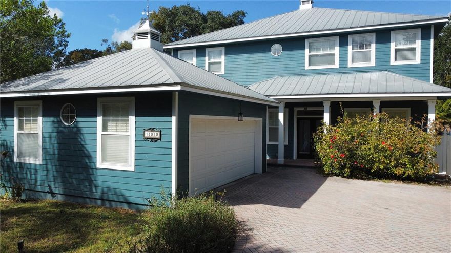 Picture Perfect KEYWEST style Gated home with all the charm of a Hemingway novel.Situated on the waterfront of the Hillsborough River, walkway to private dock surrounded by lush landscaping..Currently the home has spacious Three Bedrooms, 3.5 Baths with Two Master Bedrooms (downstairs and upstairs).Stunning wood planked hi-gloss oak floors throughout the entire home, tile in the baths. High ceilings draw your eyes up to the transom windows and crown molding.Indoor and outdoor surround sound Bose speakers Wrought Iron detailed railing leads to the balcony, bedrooms and laundry room. Custom paint color blocked per room! Kitchen features solid wood raised panel cabinets, granite counters, gas Jenn-Air 5 burner range with double oven, stainless steel appliances microwave and Four door refrigerator. Walkin pantry.Great Room has a gas fireplace and triple French Doors that lead to a covered patio with herringbone pavers and wood planked ceiling,outdoor kitchen;expansive wooddeck all overlooking the beautifully landscaped over sized yard, Gazebo and walkway to the dock. Water fall,two fish ponds and one lily pond & 18 hole putting Golf course .8 x 12 shed with windows. Perfect for out door entertainment , koy ponds water fall . mini golf and much more. Storrage shed .The home has wireless security system.All new sod and a lot of fruit trees.Picture yourself sitting on lounge chairs on the dock enjoyings sunsets!Convenient to major highways,I-75,I-275,USF,Restaurants,Shopping $ more!