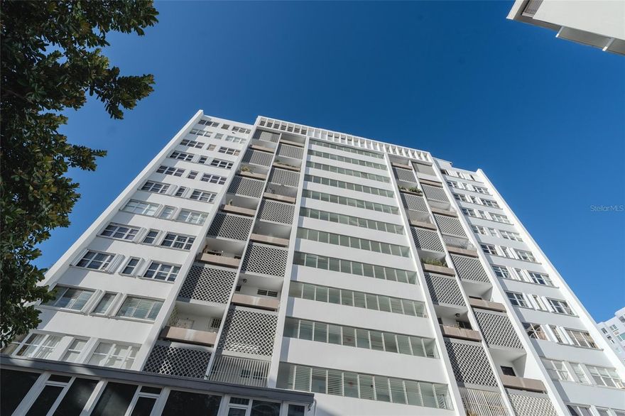 Step into an impeccably remodeled  Condado apartment with ocean and city views. In this 1,884 sq. ft. residence,  modern design meets coastal charm. Featuring 2 spacious bedrooms plus a custom-designed office, this sunlit home offers effortless comfort with cross-ventilation and a serene north-facing orientation. The office space is easily converted back into a third bedroom.
Just steps from the sands of Kings Court Beach, enjoy the best of Condado living with top schools, fine dining, boutique shopping and just minutes from trendy Loiza Street. The residence includes one garage space and an additional reserved parking spot, along with the peace of mind of a full generator, cistern, and security.
Live the lifestyle you deserve —20 minutes from Old San Juan and the airport.