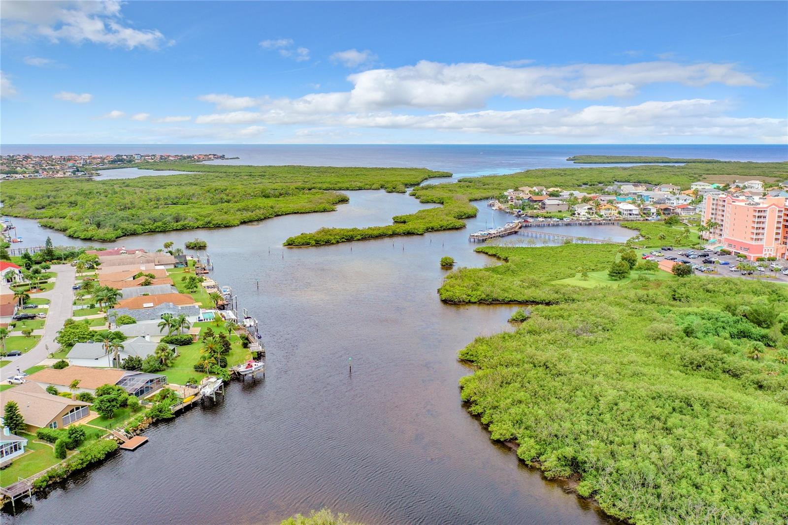 Rare interior lot with a boat slip offering Gulf access! Start living the beach life today! This lot enjoy South-West views offering a beautiful nightly sunset spectacular! Walk to your assigned boat slip within the community
and head out to the Gulf in minutes! The assigned boat slip provides deep water access with quick ride to Gulf of Mexico. This small, gated community is filled with several newer 2 and 3 story homes. Harbor Colony
residents also enjoy access to the private, residents-only beach club with pavilions, bathrooms, grills and also serves as a hub of neighborhood activities and events. Enjoy close proximity to public Green Key Park/Beach,
downtown New Port Richey/Sims Park events and restaurants, and many waterfront restaurants accessible by boat. Easy access to Tampa/St. Petersburg/Tampa International. HOA allows 30-day rentals. Note building
minimum 1800SF 2 bedroom or 2100SF 3 bedroom. Build your dream home and start enjoying the Florida beach life today! Builders upon request.