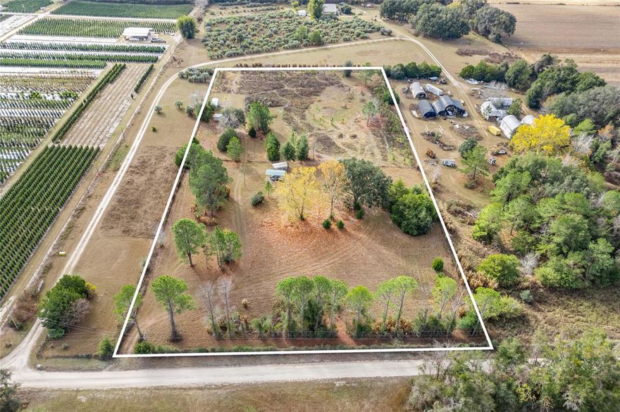 Discover a hidden gem nestled on 5 beautiful, private acres—a rare opportunity for those seeking seclusion, serenity, and limitless potential. With only one neighboring property and a tree farm bordering the other side, this land offers an exceptional blend of privacy and peaceful, natural surroundings. Currently zoned Ag and ideal for beekeeping, the property provides the freedom to craft the lifestyle you’ve been dreaming of. It’s fully fenced and already equipped with power, a well, and septic, making it truly ready for your vision. Two carports and two sheds offer convenient storage, while the back of the property opens into a sun-drenched meadow that becomes especially stunning in the spring and fall. Whether you plan to build your dream home, create a quiet retreat, or bring your camper for tranquil weekend getaways, this versatile property offers unmatched flexibility. Enjoy the peacefulness of nature while remaining just a short drive from Alachua, High Springs, Gainesville, and Lake City. A private sanctuary with unlimited potential—come experience what makes this property truly special.