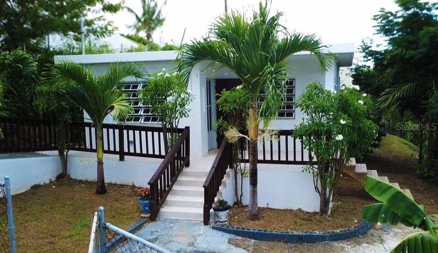 Welcome to this beautifully renovated, turnkey 2 bedroom, 2 bathroom gem in Bravos de Boston. A small but ample home with room to grow, the main living area tastefully and comfortably remodeled. New concrete kitchen counters, new fans, upgraded electrical, completely remodeled bathroom, new AC's installed in the bedrooms, concrete work and fresh paint all around. The yard has a variety of flowers, and trees, including banana, Guanabana, and more!

Out the back door the addition lost its roof in Maria, but walls and windows and bath remain to a large extent. Bathroom is working and hooked up. Needs a re-design. Needs a roof and this could be an entirely separate unit or expanded into a larger single family. Great potential for additional income.   Amazing views if a rooftop deck were built!!

Fall asleep to the sound of the ocean less than 1/2 mile away. Walk to La Lanchita and La Chatta Beach!  Ocean views from rear of structure when a fabulous rear deck could be added. Gorgeous rolling hills neighborhood views as well!
This property is untitled, but title work is in process.