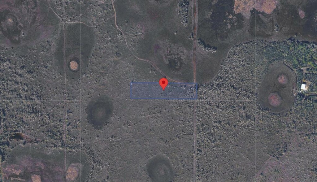 Photo of 33580 Oil Well Rd, Punta Gorda, FL 33955 (MLS # O6453340)