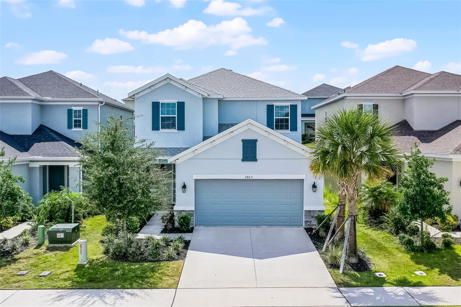 This beautifully maintained Clermont home is practically brand new and nestled within the GATED COMMUNITY of Crestview. Enjoy access to a sparkling COMMUNITY POOL surrounded by lush landscaping, playground, clubhouse, and scenic sidewalks perfect for evening strolls. One of the sellers’ favorite features is the home’s prime location just around the corner from the amenity area. Step inside to find 18” tile flooring throughout the main living areas on the first floor. The open floor plan and soaring ceilings fill the space with natural light, while remote-controlled window treatments on the sliding glass doors add a touch of modern convenience. The kitchen is both stylish and functional, offering a walk-in pantry, quartz countertops, stainless steel appliances, breakfast bar, upgraded pendant and recessed lighting, and a motion-activated faucet. The primary suite is located on the main level and includes dual sinks, stone countertops, a spacious walk-in closet, and a large tiled shower. Upstairs, you'll find a second primary-style bedroom with an en suite bath, along with three additional bedrooms that share a full bath. The loft area provides versatile space, perfect for a home office, media room, craft area, or playroom. It can also be converted into an additional bedroom, if desired. This home is conveniently located less than 3 miles from Southlake Hospital, about 5 miles from historic Downtown Clermont, and just under 10 miles from Plant Street in Winter Garden. Nearby attractions include Lake Louisa State Park, the Clermont Chain of Lakes, Disney Parks & Resorts, and an abundance of shopping and dining options.
